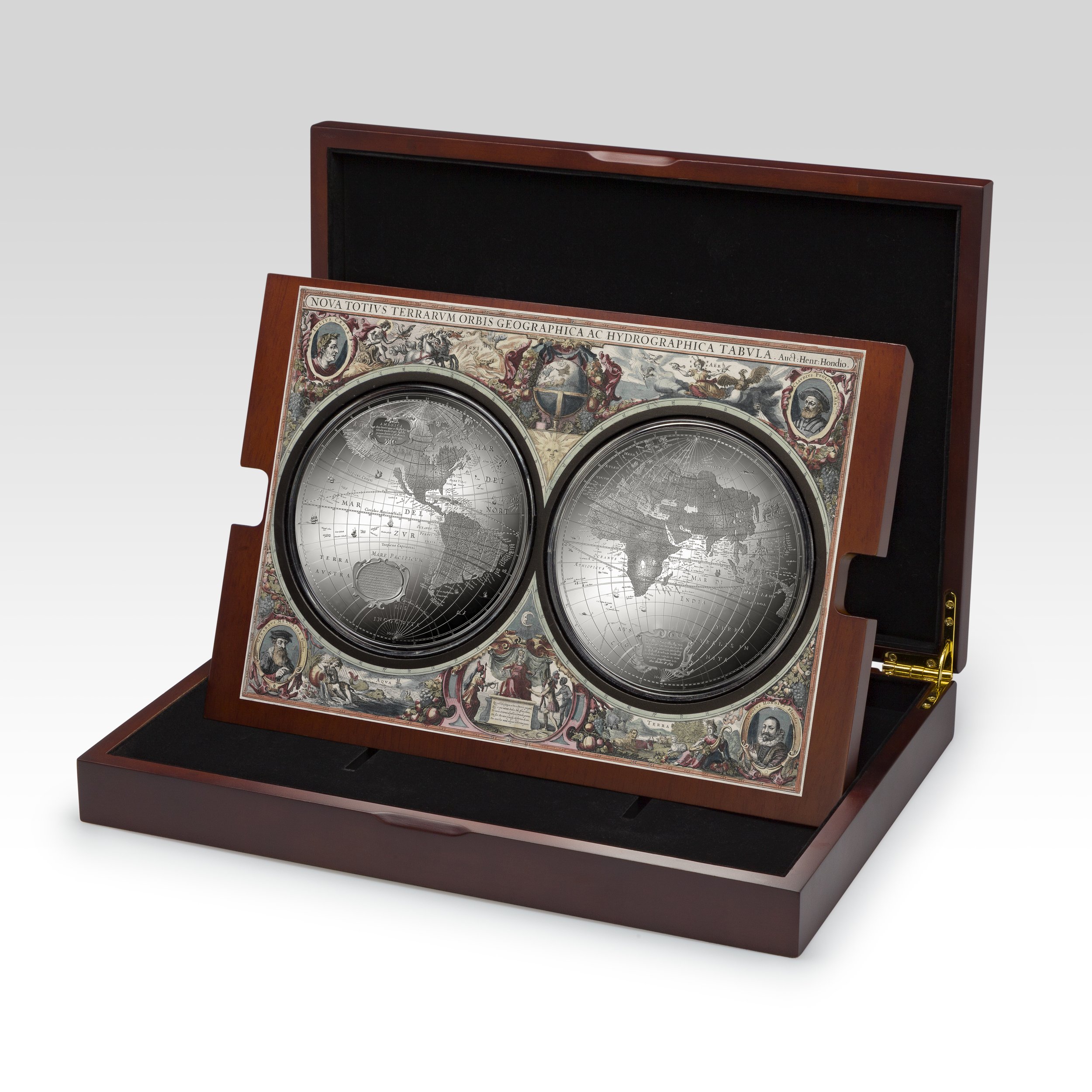 A vintage celestial globe with two hemispheres featuring maps, resting in a wooden presentation box.