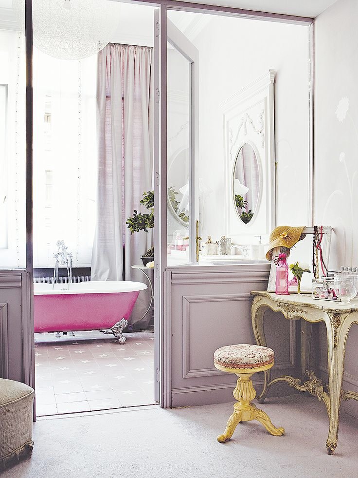  This bathroom is oh so French. I really applaud people willing to paint their walls unique colors like this shade of lavender. &nbsp;  Image via  Gravity Home  