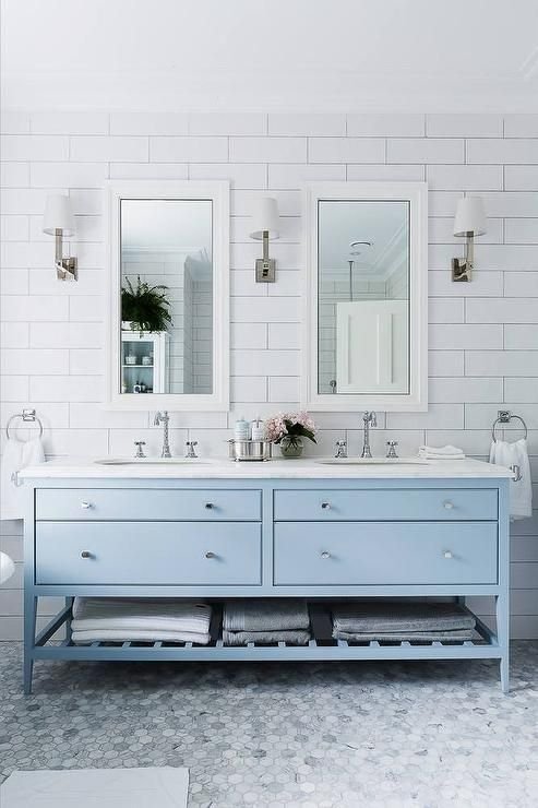  The vanity and tile floor brings in the icey blue color to this bathroom. &nbsp;It feels so crisp and clean, but definitely cool. &nbsp;To warm it up, I might swap out the chrome fixtures and hardware for brass. &nbsp;Still a beautiful bathroom that