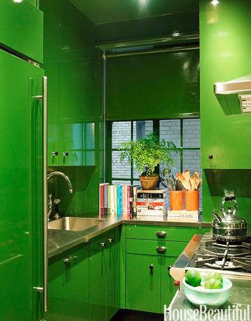  This has LONG been one of my favorite kitchens. &nbsp;Using a bold color in a small space makes such an impact. &nbsp;How fun would it be to cook in this space?  Image via  House Beautiful  