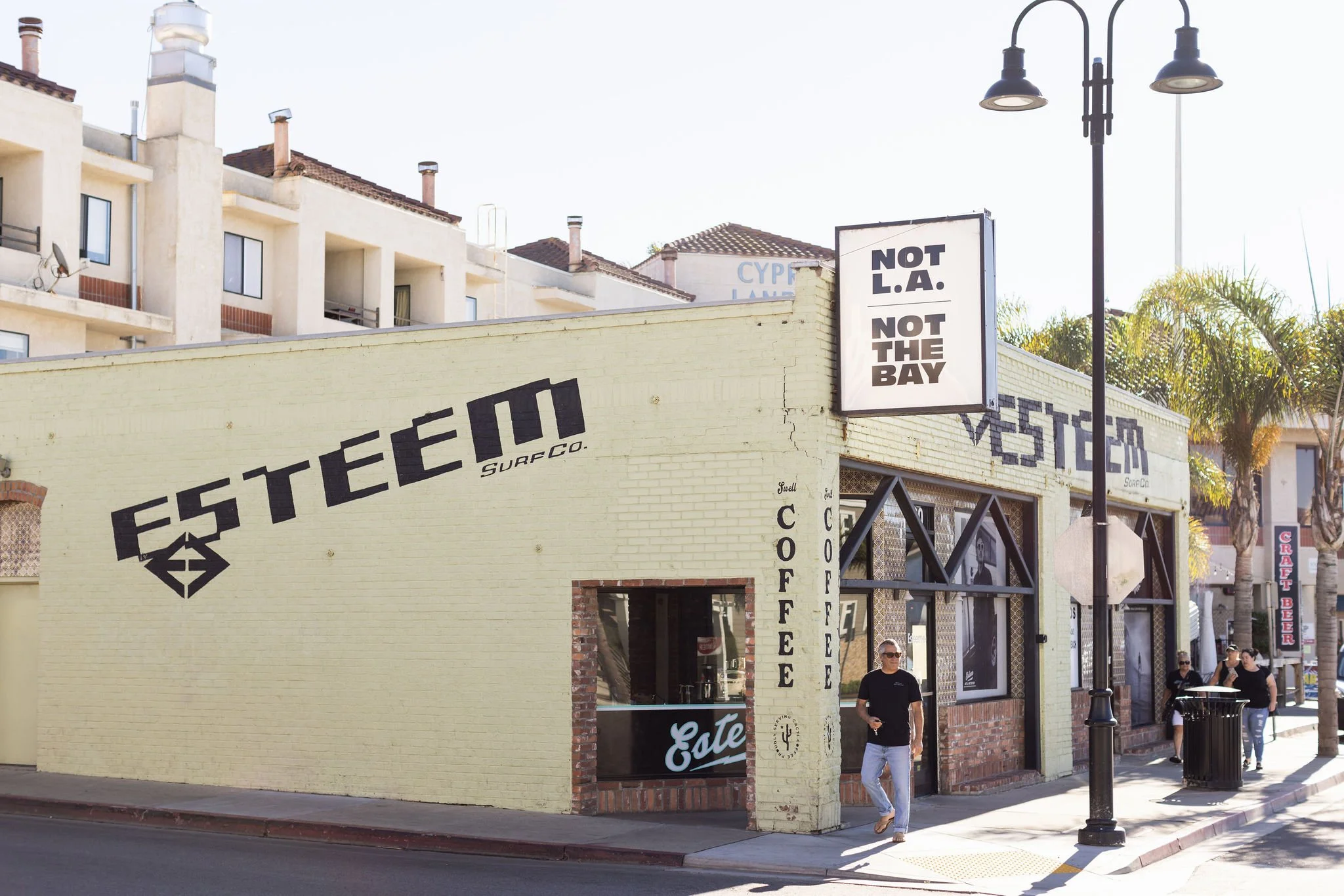 Exterior of Esteem Surf Co. building with "Not L.A. Not The Bay" sign in San Diego.