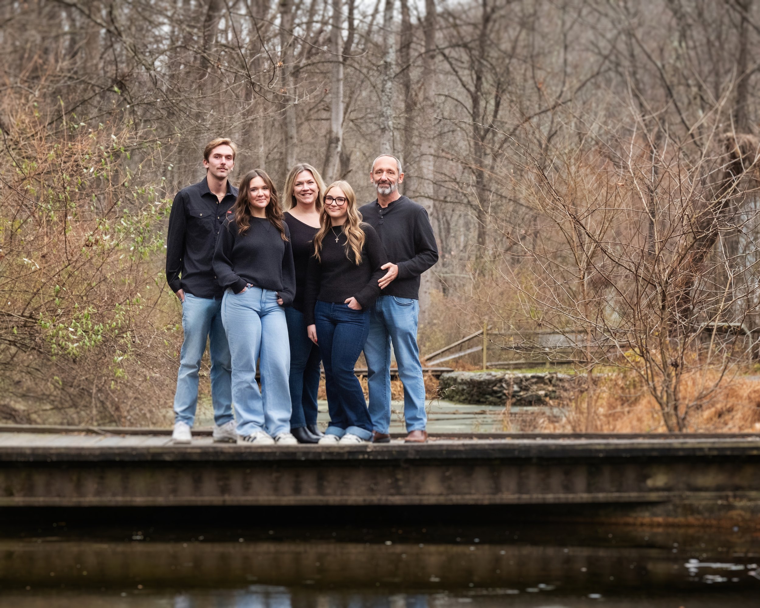 A color outdoor family portrait photograph taken by Artemas Photography at Nixon Park in York, PA Pennsylvania