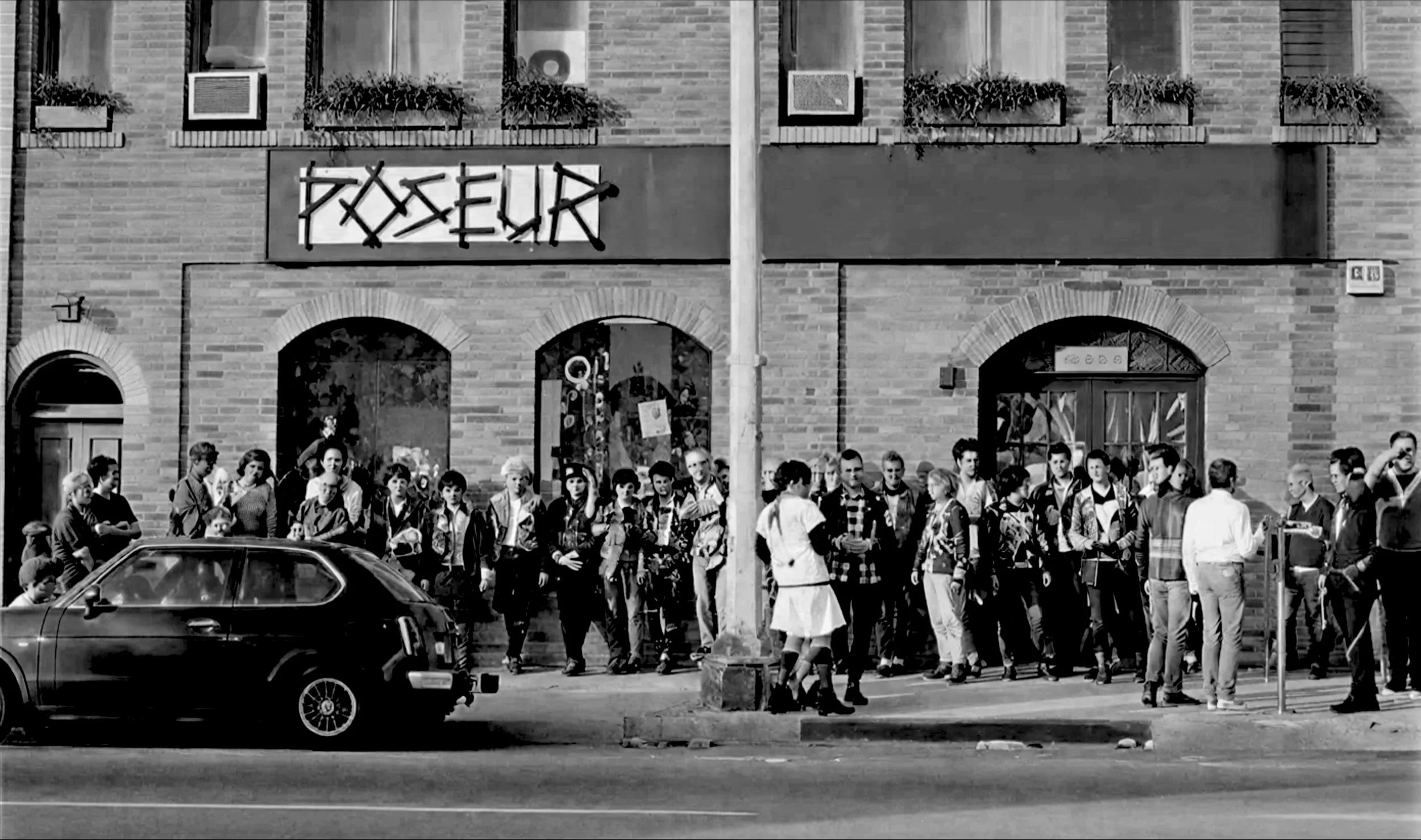 Crowd gathered outside Poseur on Melrose during the early Los Angeles punk and underground music era