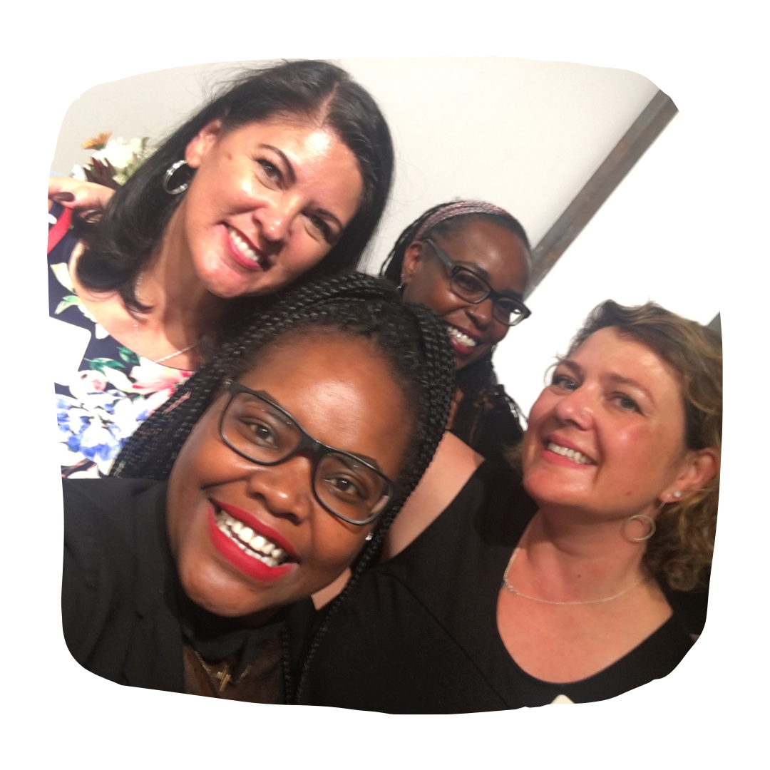 Shontel surrounded by smiling community members