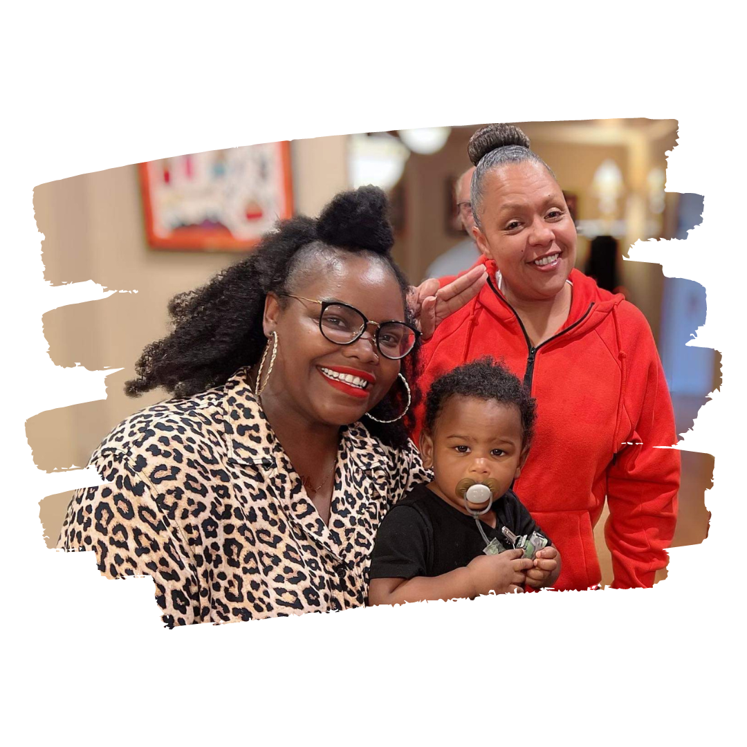 Shontel with a smiling woman and baby