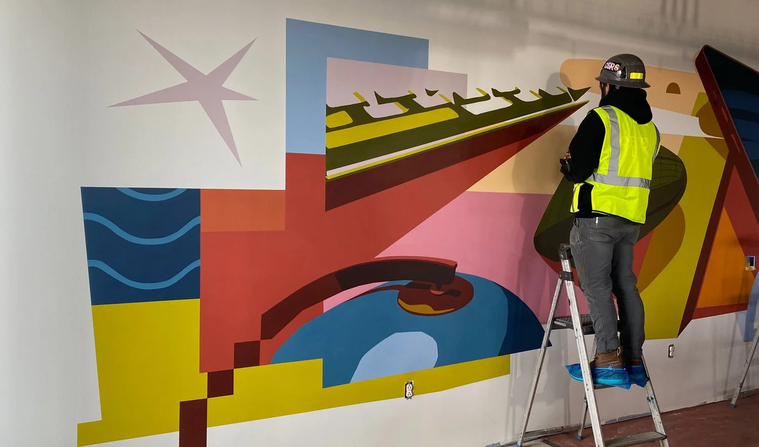 In progress view of a Interior data center office mural in Jeffersonville, Indiana that depicts the cross between tech and local landmarks