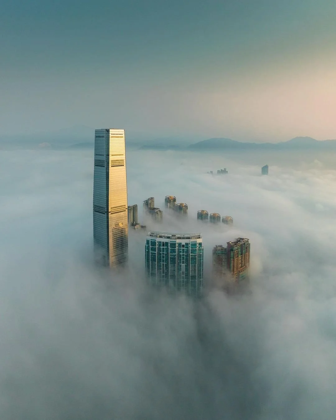 Aerial Image of the ICC submersed in low clouds in Hong Kong