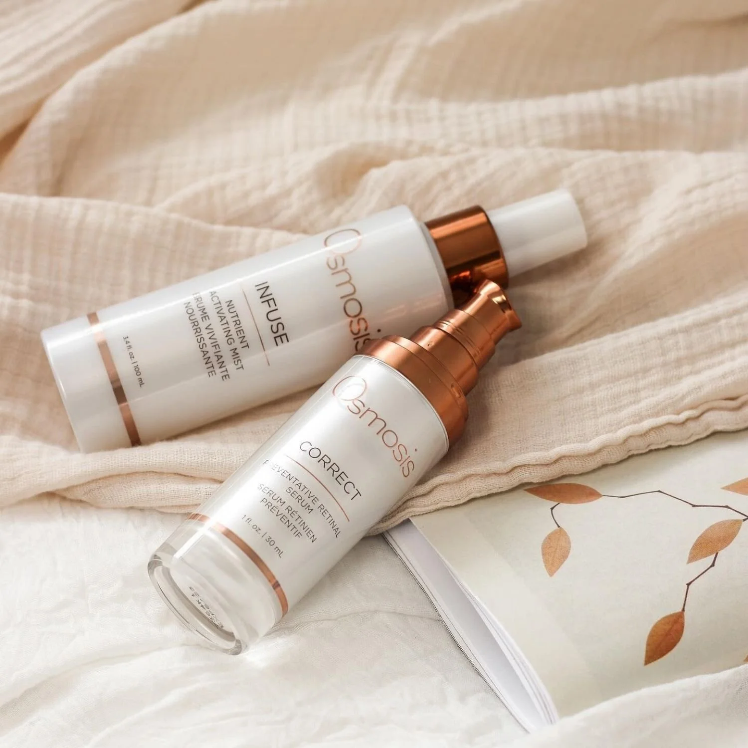 two bottles of Osmosis Correct skincare laying down on a linen cloth