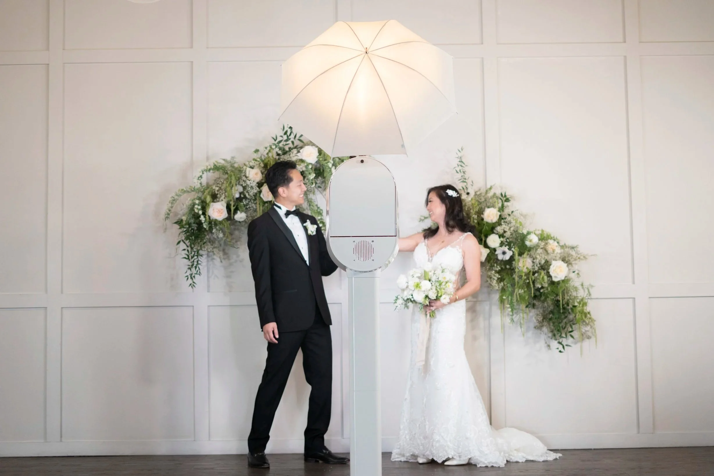 bride and groom using photo booth rental, vancouver bc