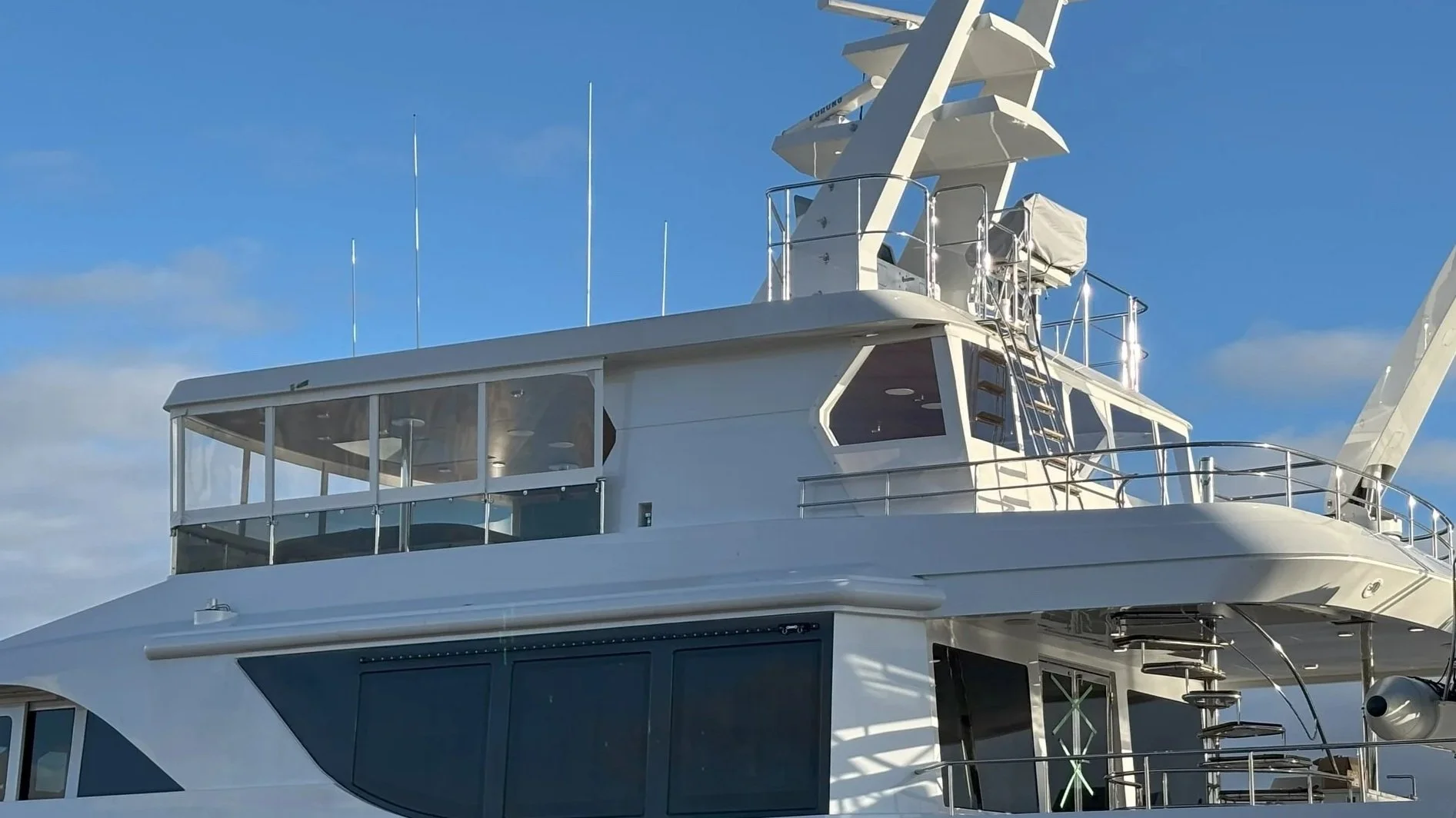 Sundeck forward and sundeck aft enclosures shown from port side on Intermarine 120 luxury yacht.