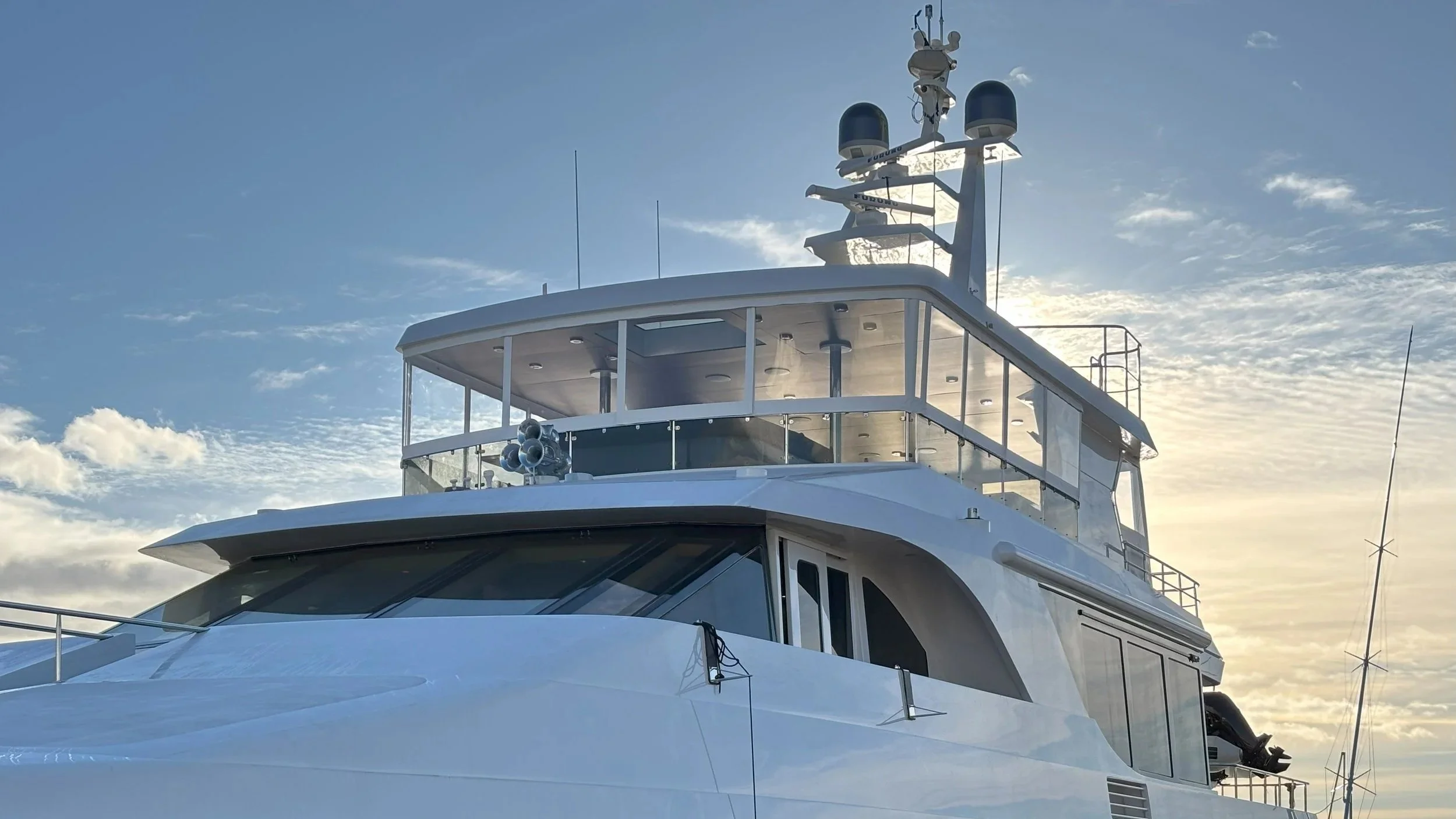 Sundeck enclosure with semi-rigid bonded acrylic panels on luxury yacht.