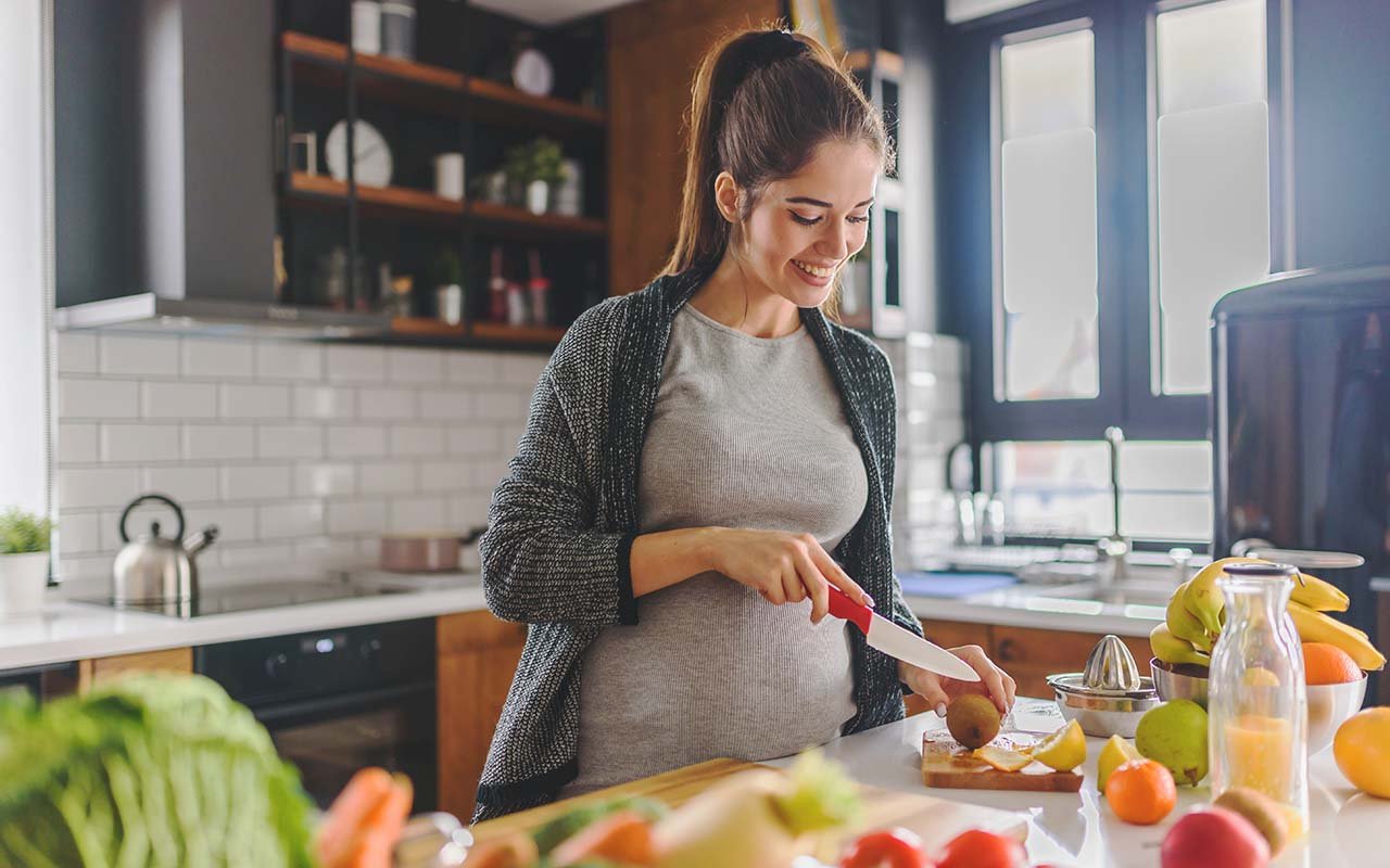 Pregnant Woman Cooking Nutritious Recipes