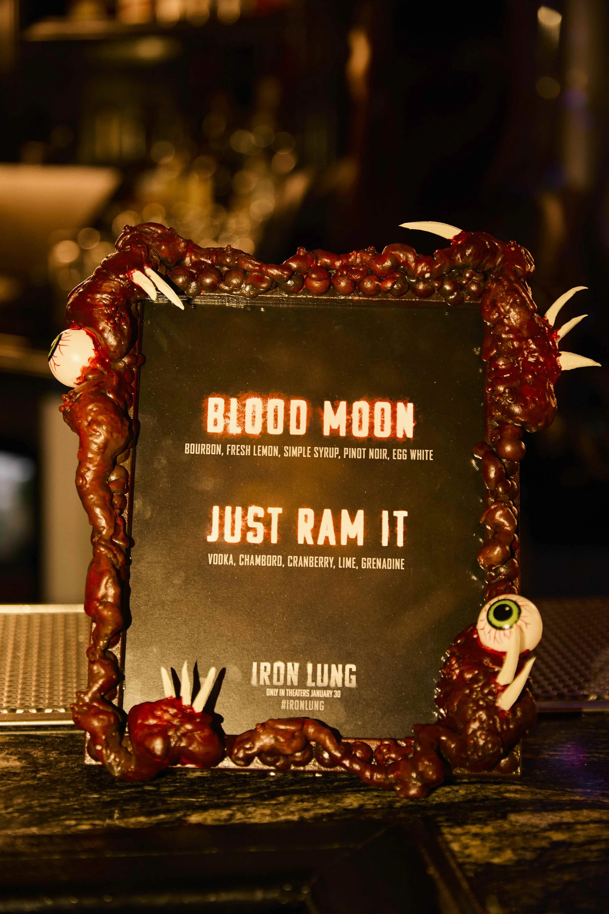 Custom event signage at a luxury red carpet premiere.