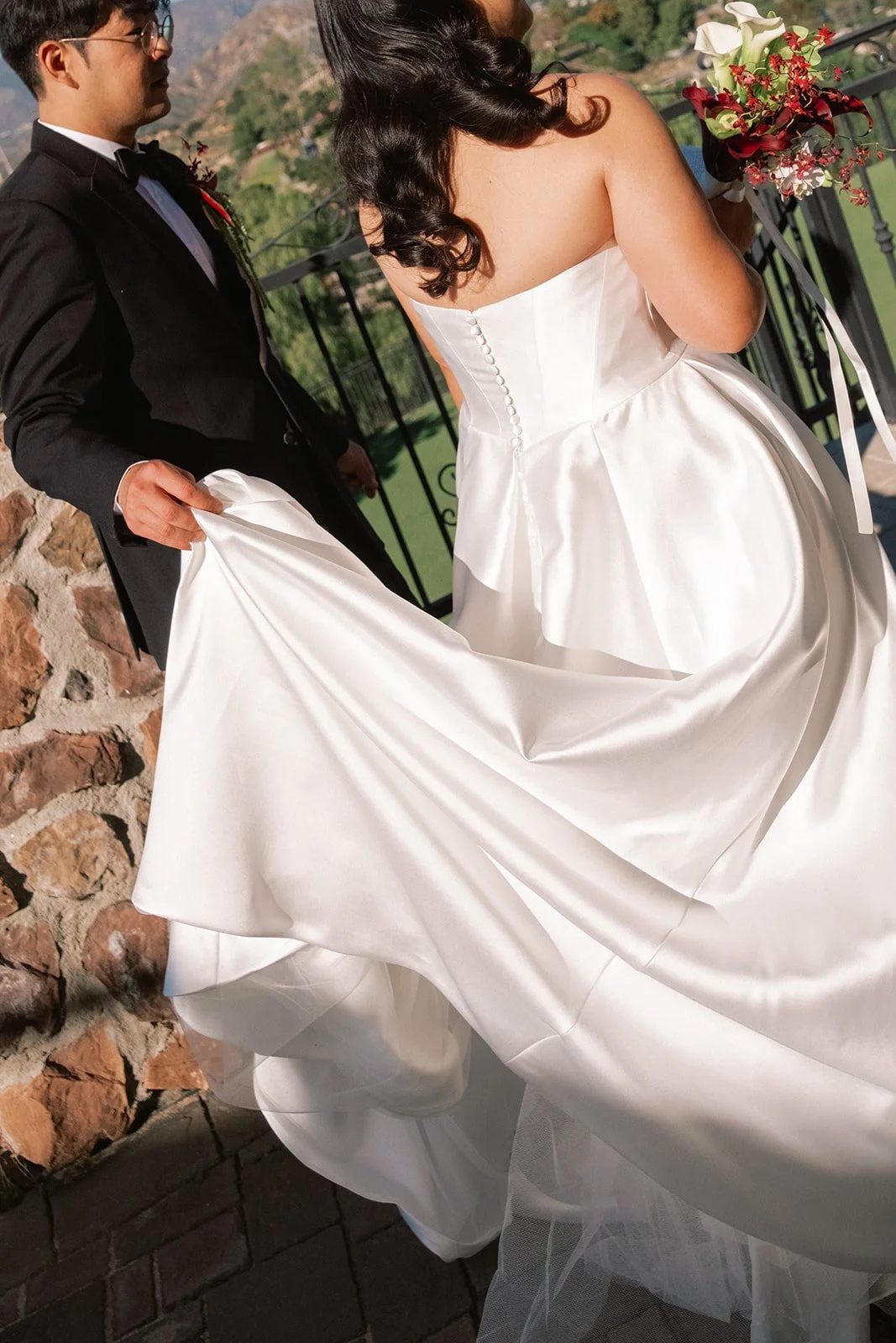 Bride holding her gown at a private estate wedding in Los Angeles.