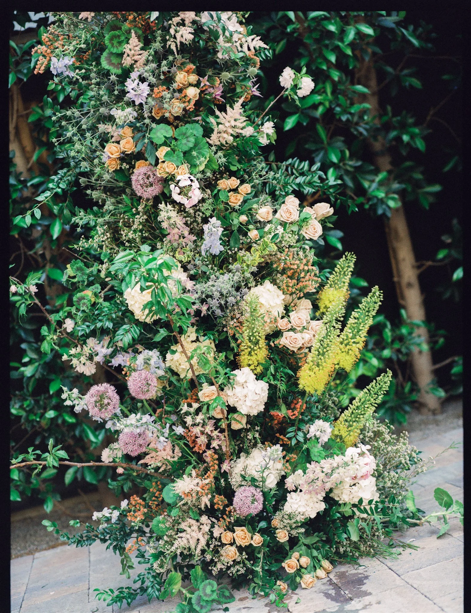 Lush floral installation at a Los Angeles restaurant wedding.