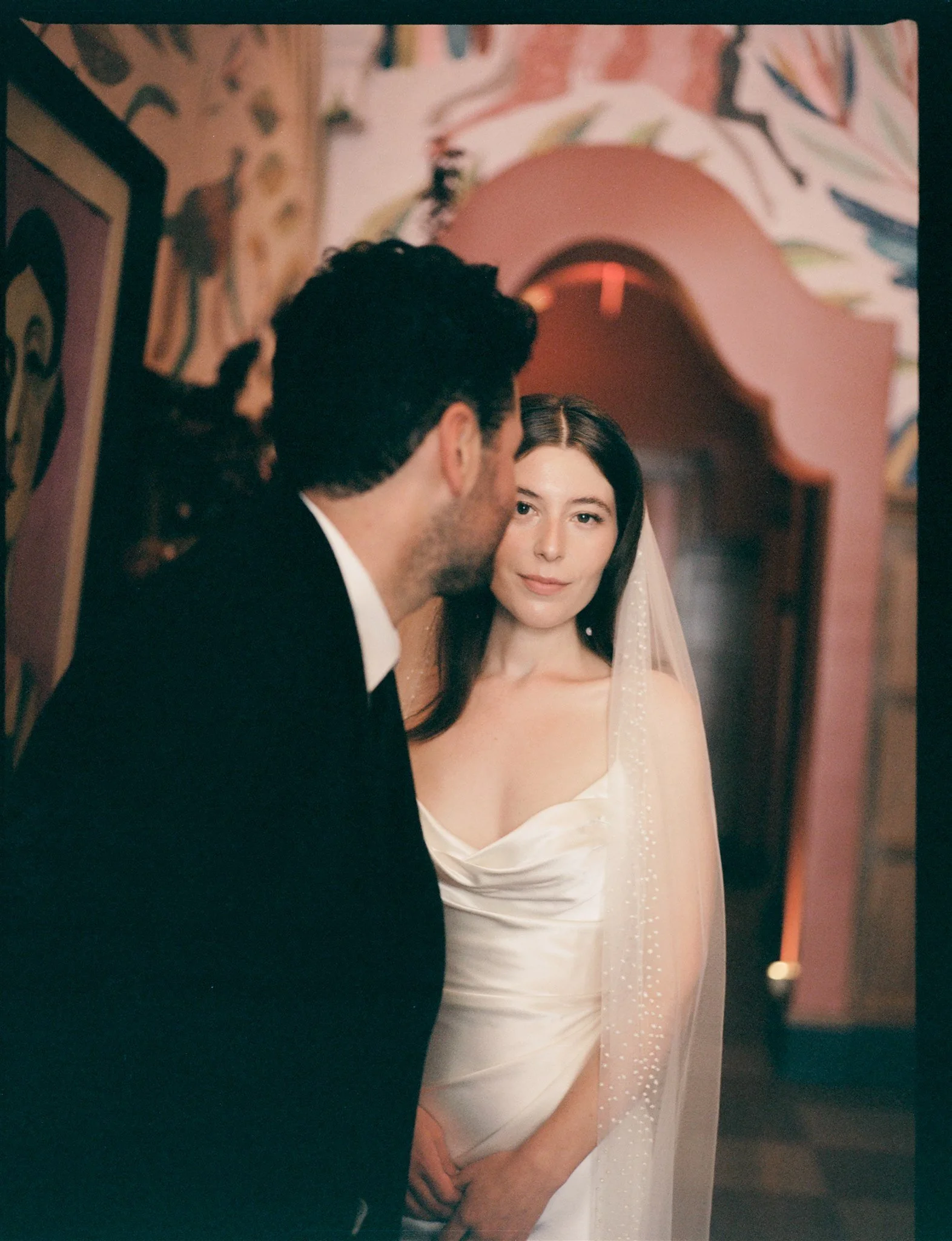 Bride and groom sharing a moment at a Los Angeles restaurant wedding reception.