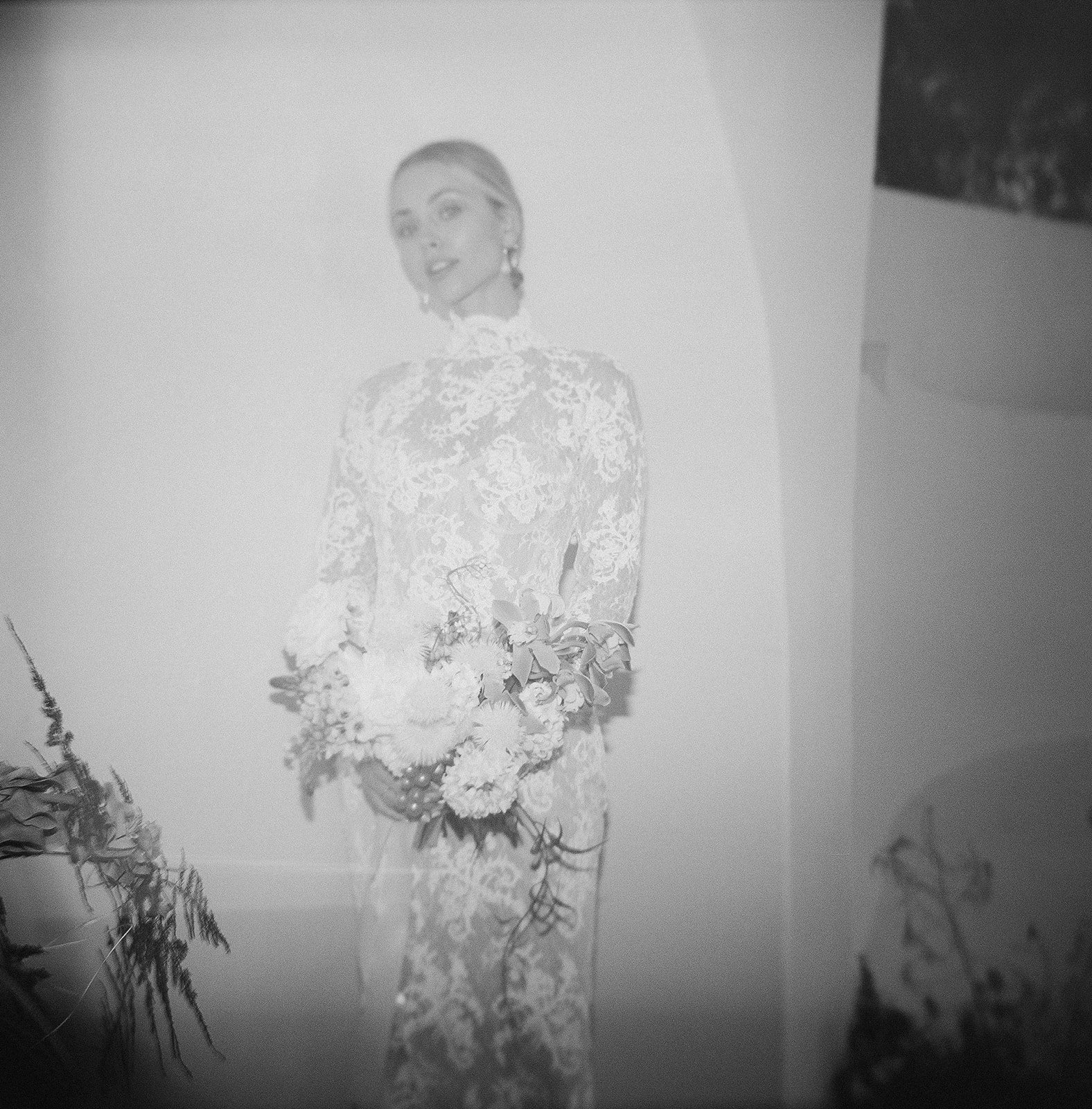 Editorial-style bridal portrait in soft monochrome tones.