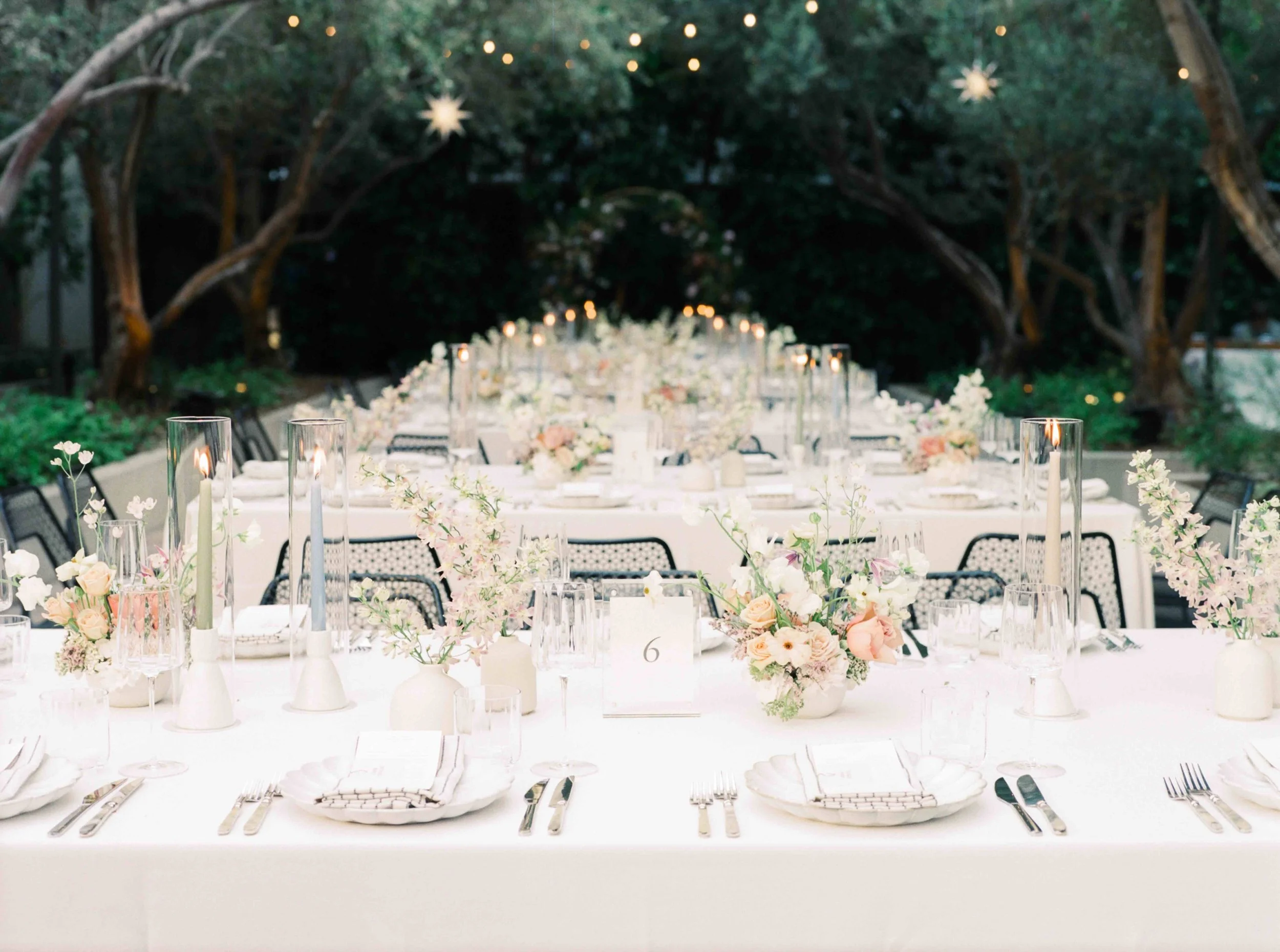 Tablescape designed by Los Angeles wedding planner with floral centerpieces and candlelight.