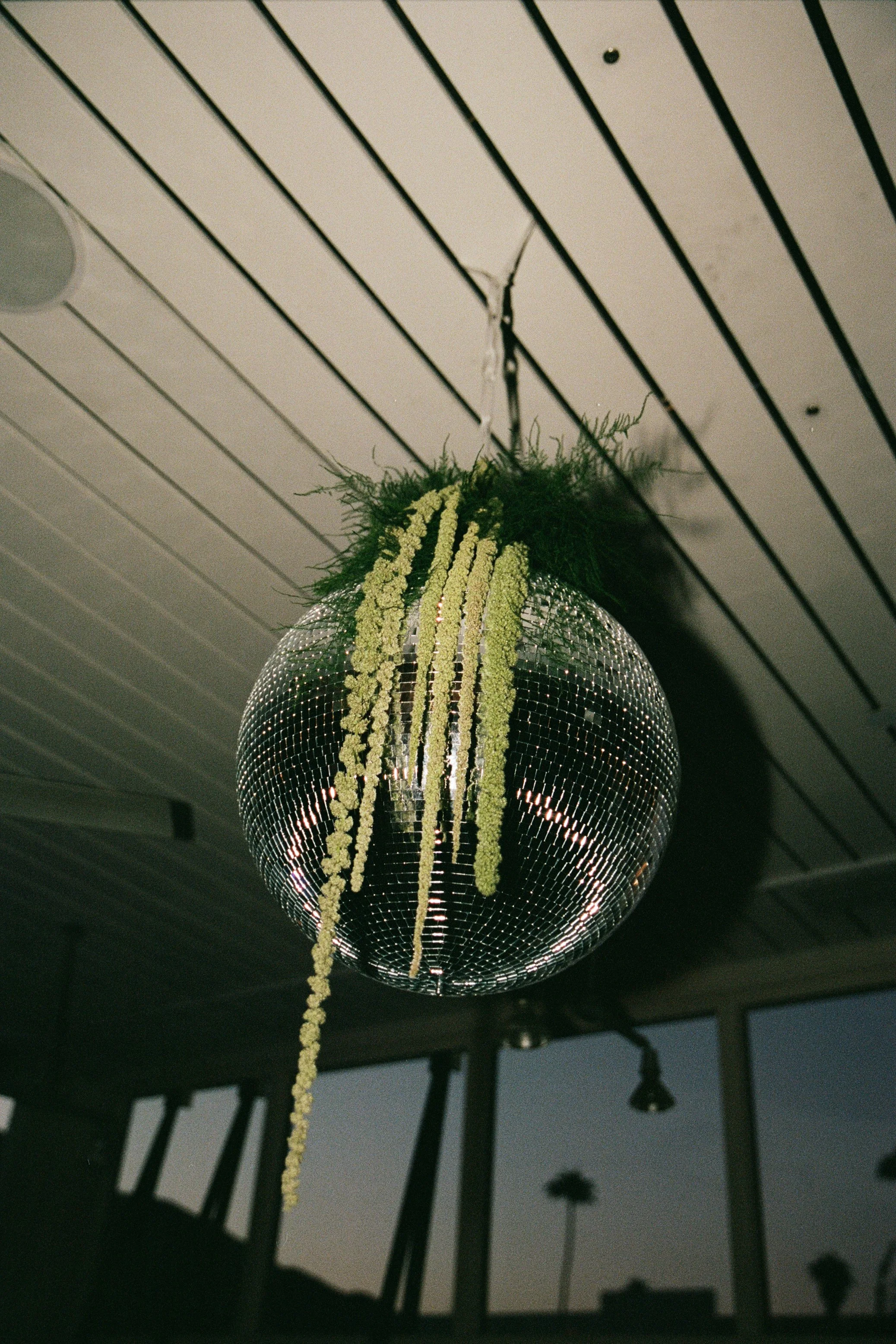 Disco ball and florals at Southern California wedding.