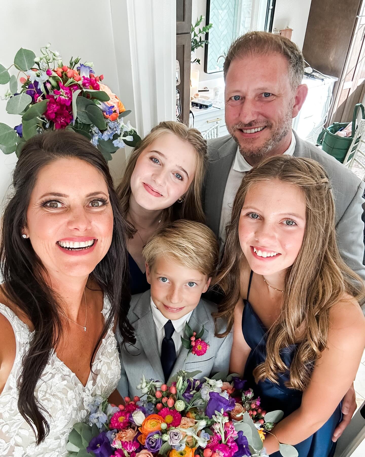 I took this selfie during one of my favorite wedding moments. Because Ben and I did a &ldquo;first look,&rdquo; we were able to hide away together with the kids and some family in our bathroom while guests sat down outside. Before it all became offic