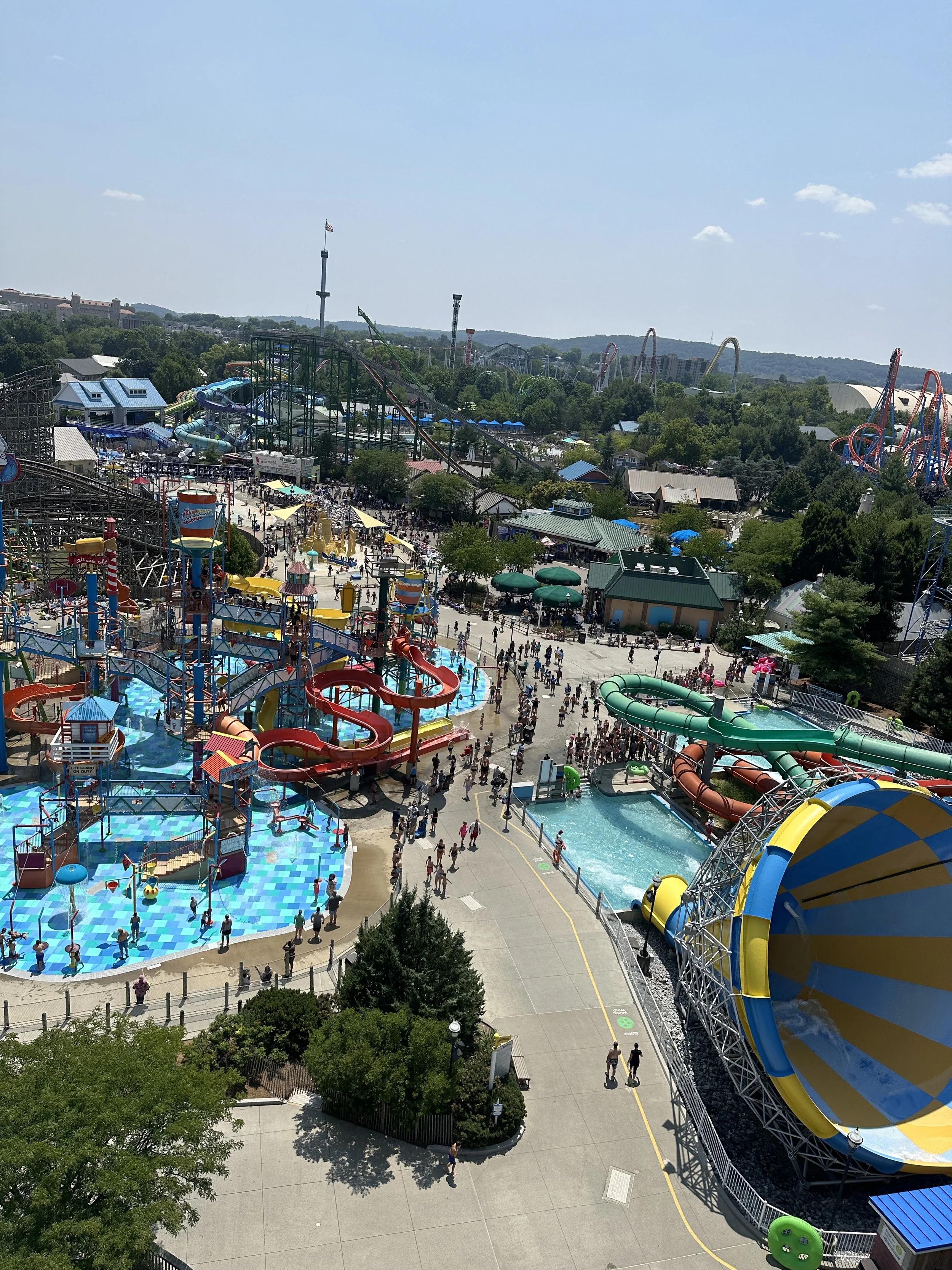 Family enjoying rides and attractions at Hersheypark amusement park in Hershey Pennsylvania