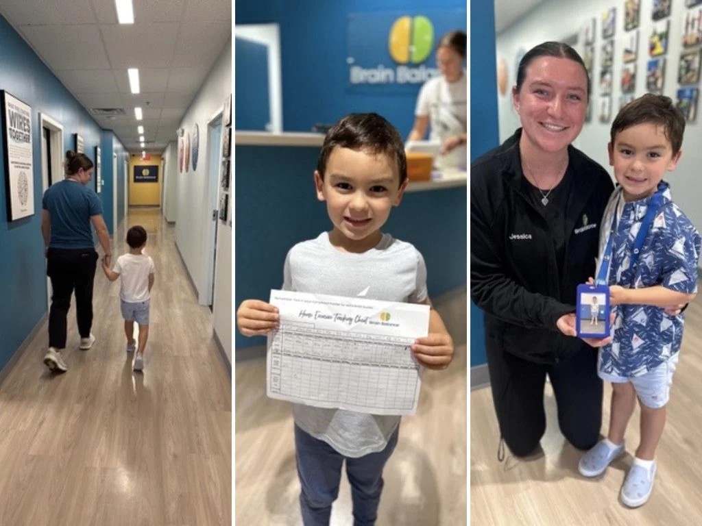 A child at a Brain Balance center walking the hallway, holding a progress chart, and smiling with a team member.