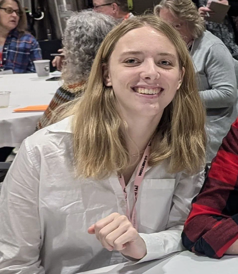 White tree and open book icon on a green circular background