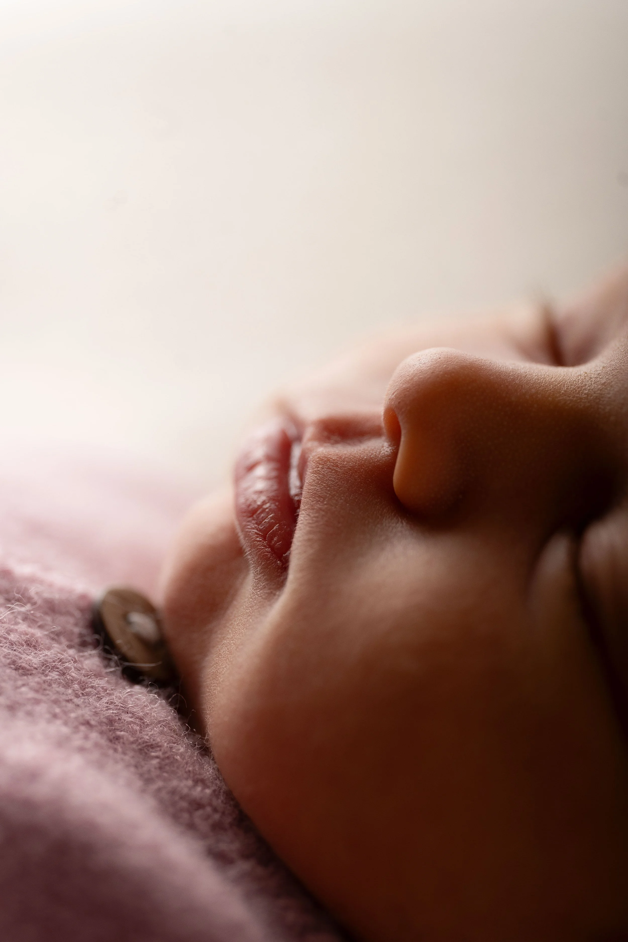 closeup image of newborn baby lips in a photography studio setup in Canton, GA