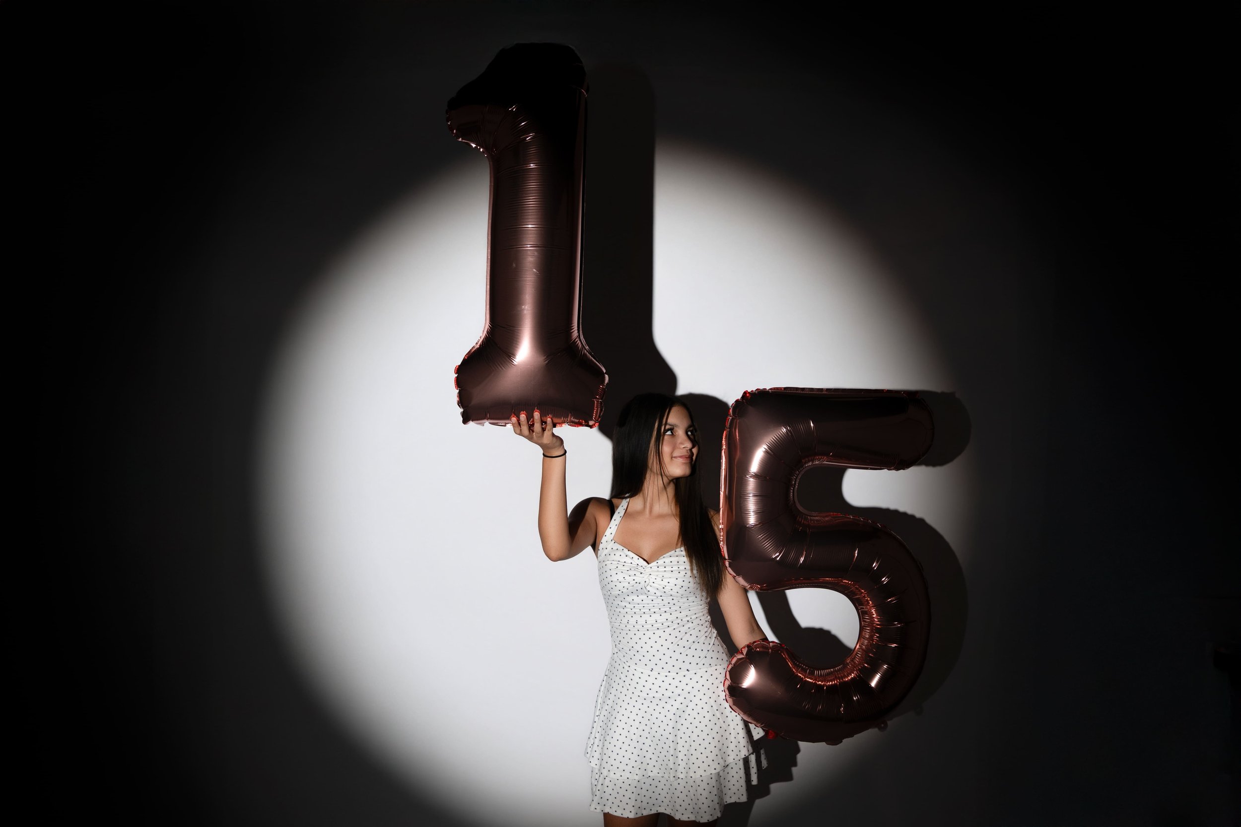 picture of a teen girl celebrating her 15th birthday in a private studio in Canton, GA with Captured Moments by Cindy
