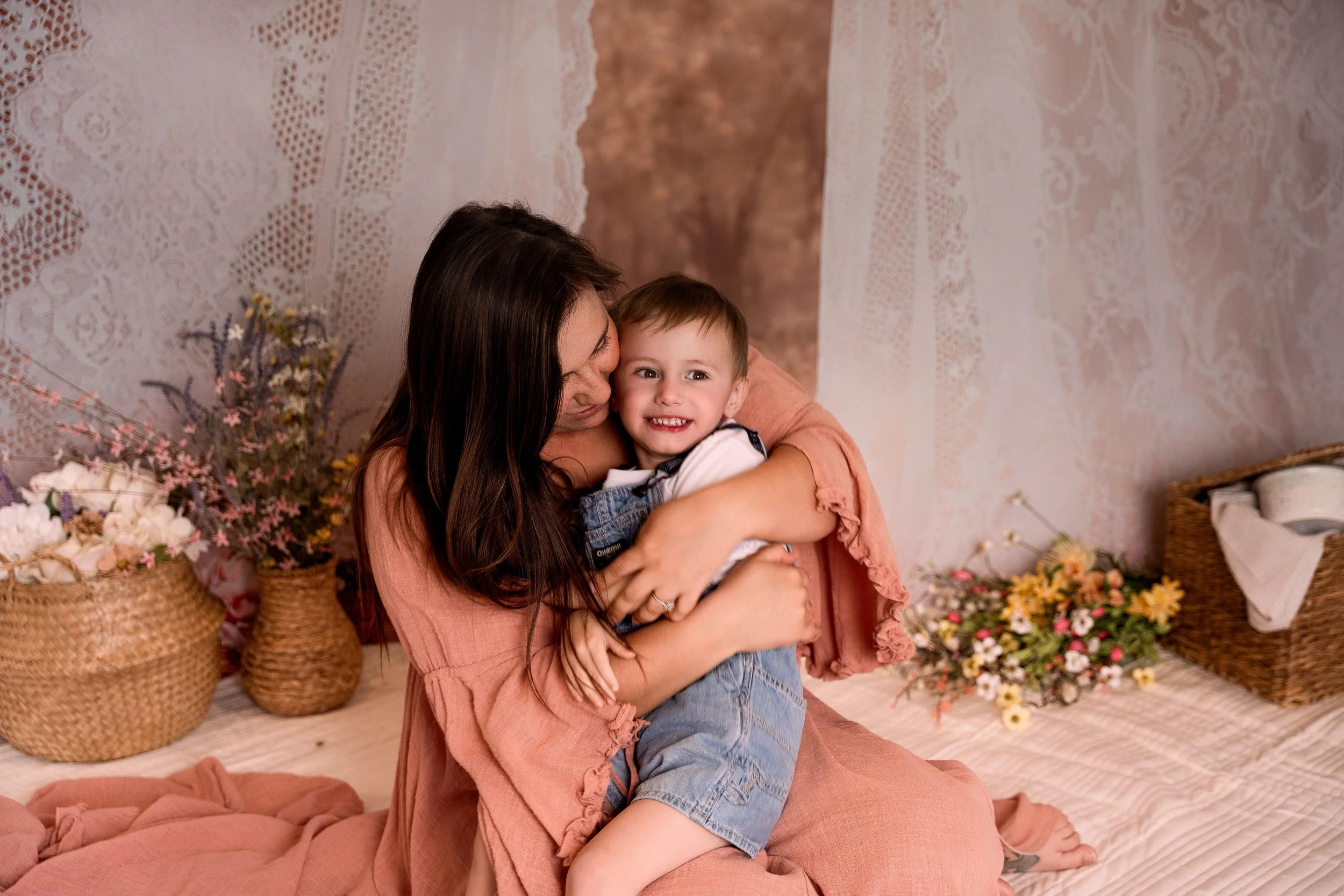 beautiful mama and her toddler son sharing a hug in this clothesline mini shoot
