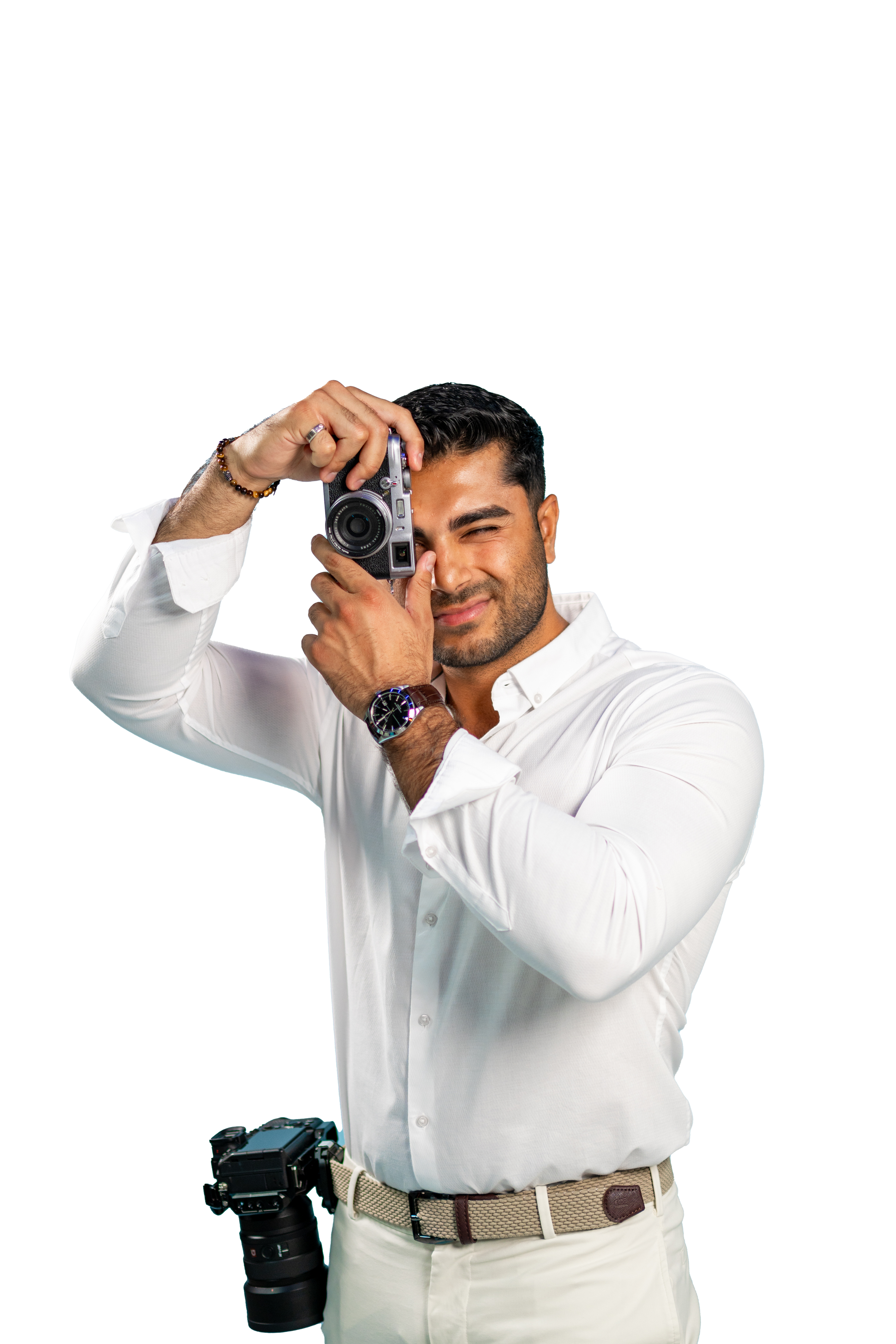 jiten melwani holding a camera and smiling