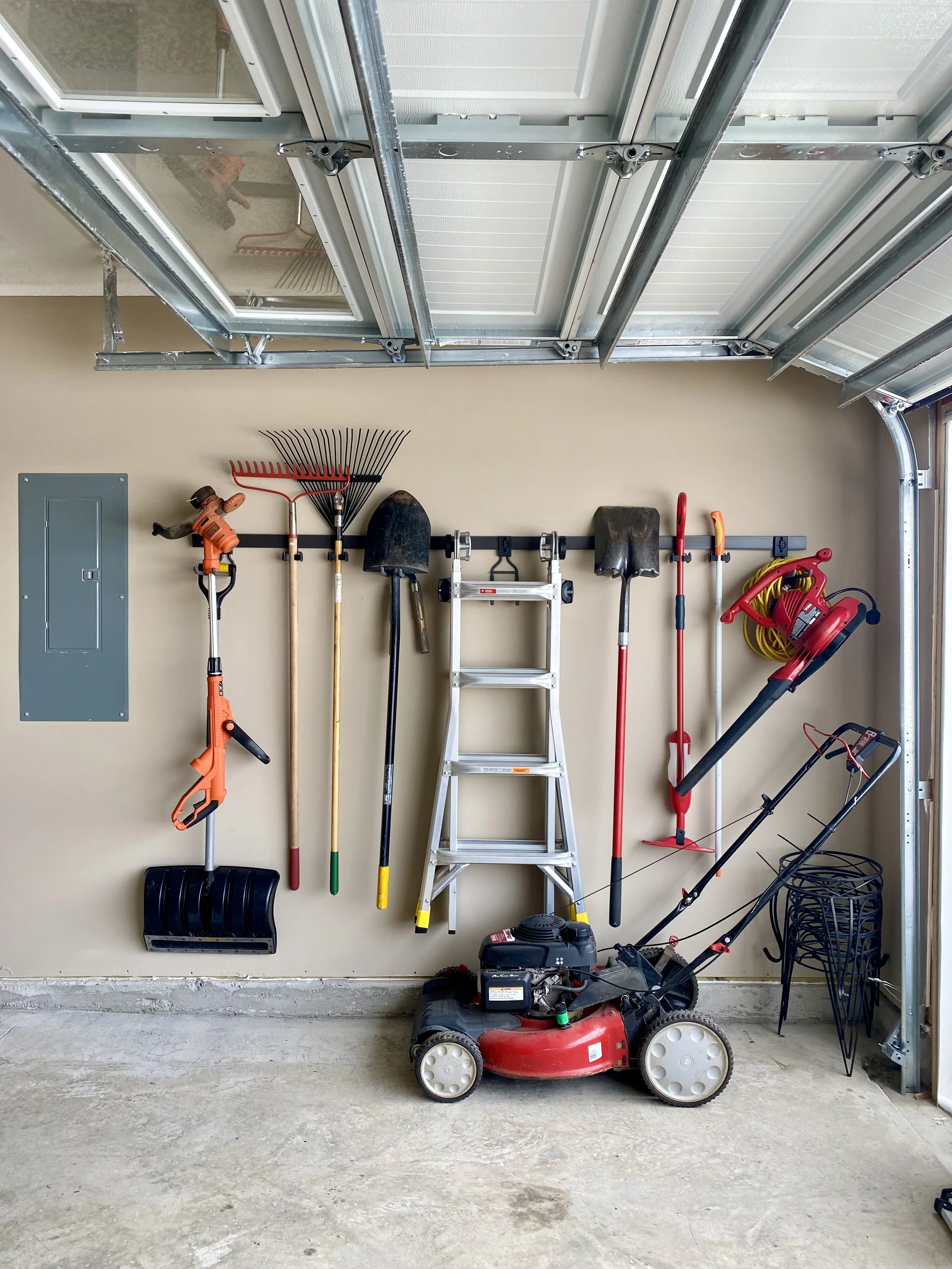 garage wall track yard tool organizing