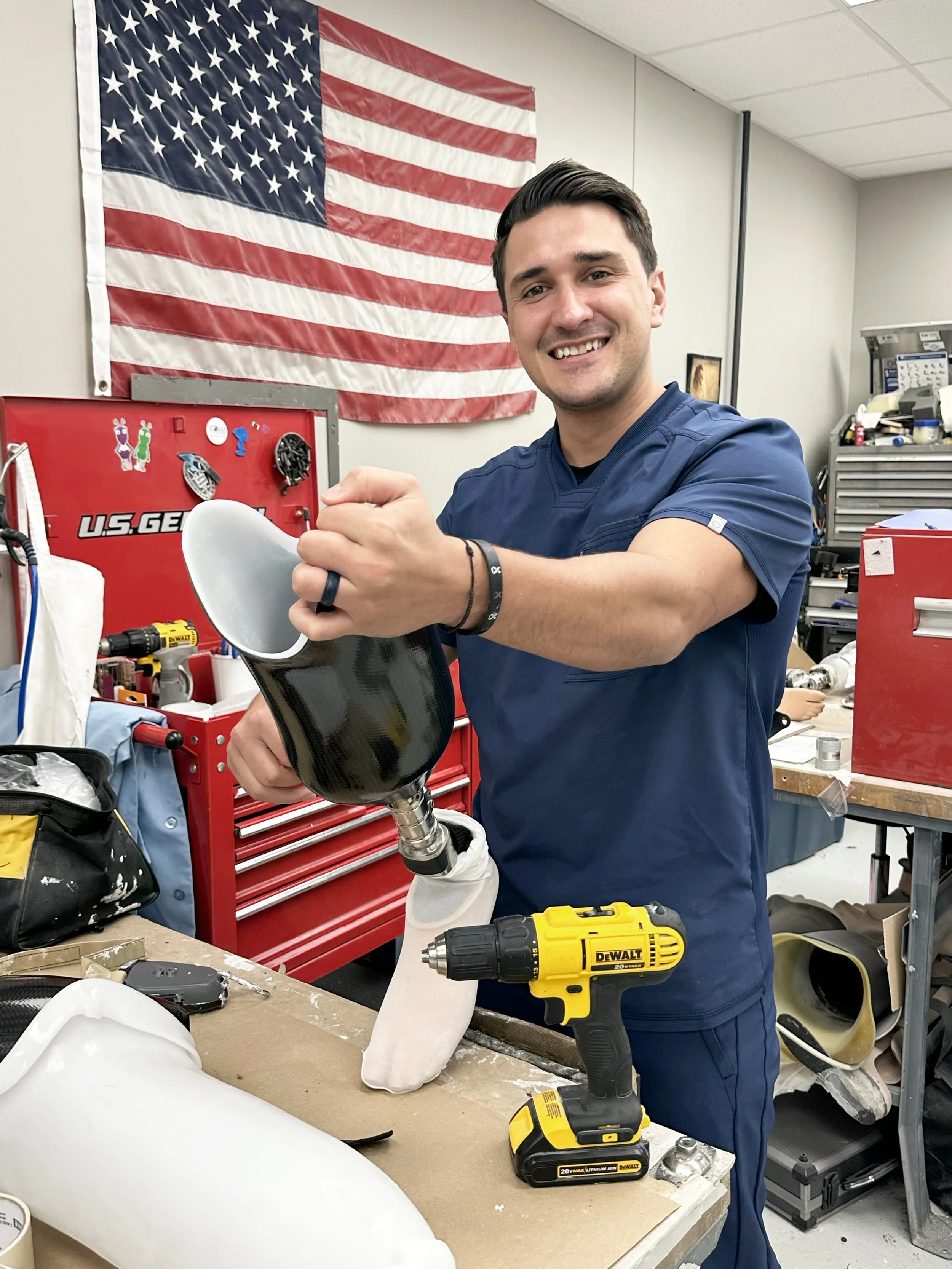 Resident, Adam, working on prosthetic leg.