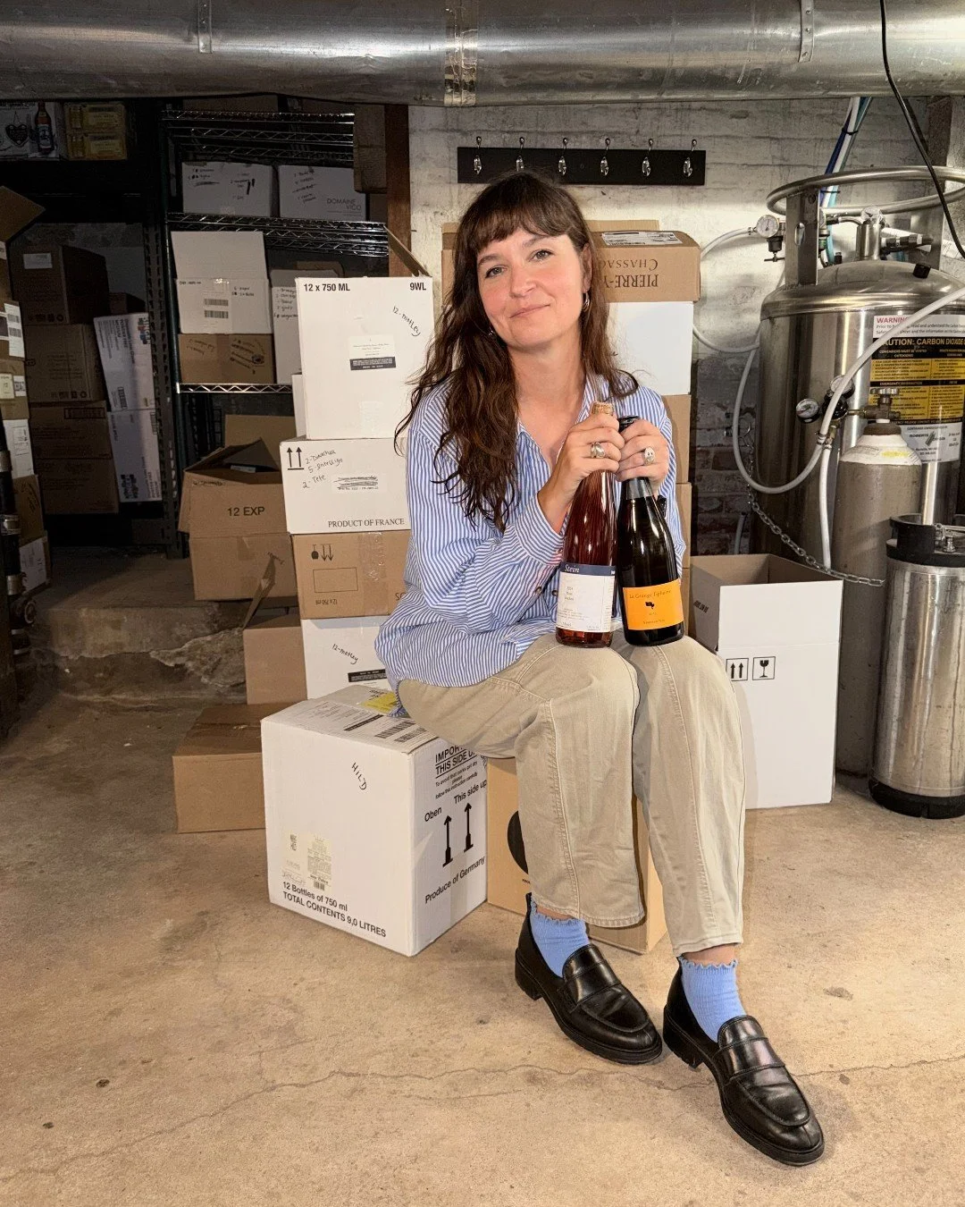 a girl in her wine lair. ICYMI, @kait_caruke&rsquo;s list officially received the @wine_spectator Award of Excellence. swing through this week to peek it. 👀