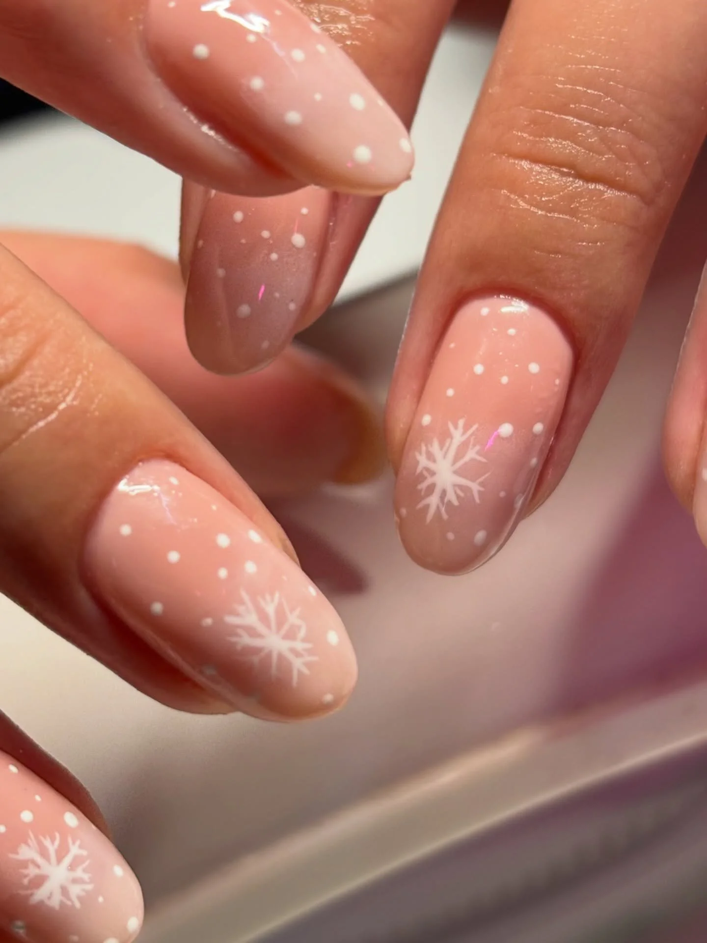 Soft glam with a winter whisper ❄️✨
She wanted something clean, cozy, and still festive &mdash; so we went sheer pink builder gel with delicate snowflake details and subtle shimmer. Simple, elevated, and perfect for the season 🤍

Builder gel = stren