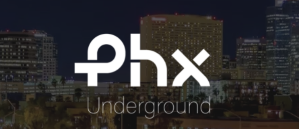 Night cityscape with tall buildings, with the logo 'Underground' in text and its Hebrew equivalent above in the foreground.