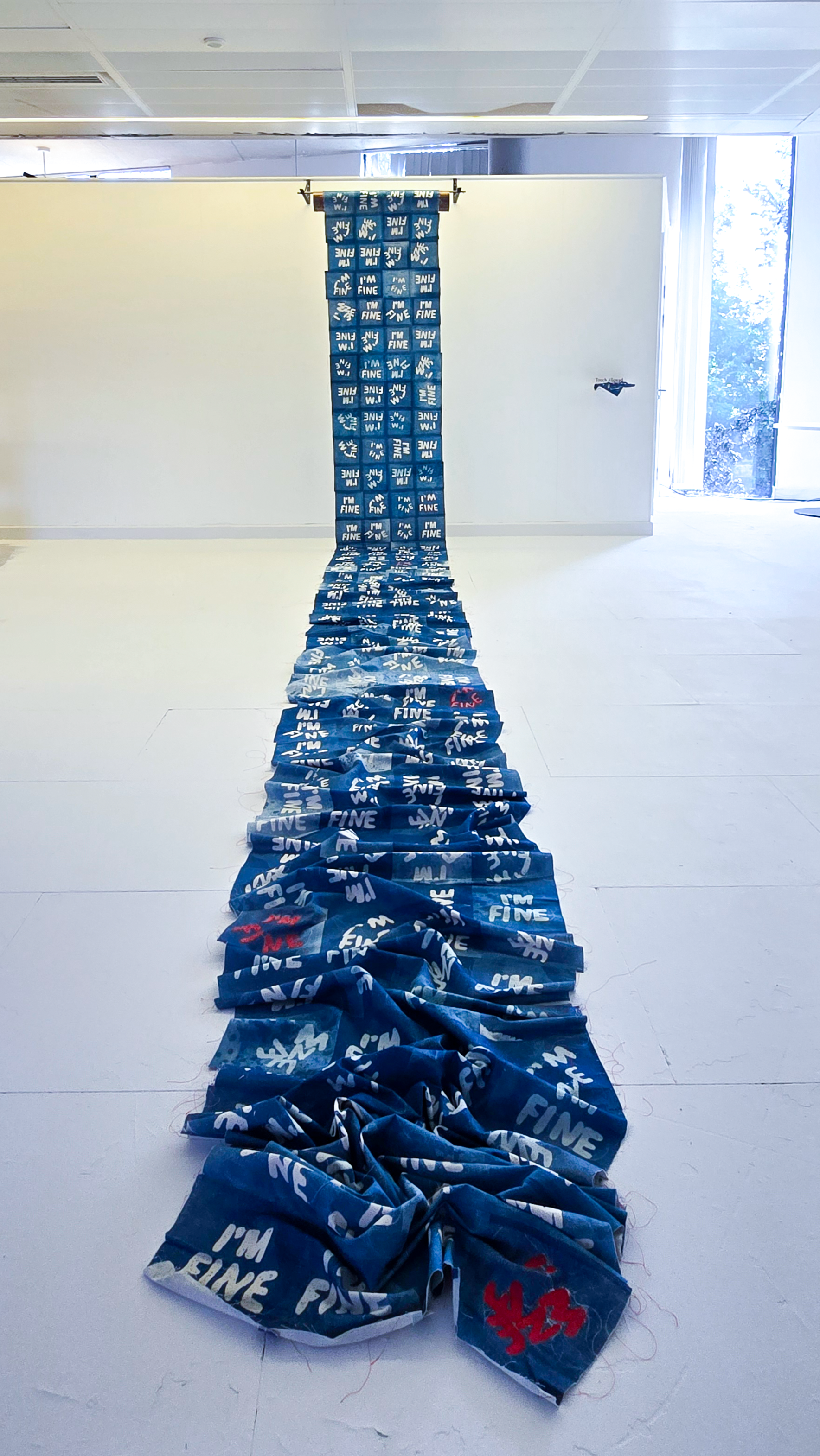 Installation photograph of How Are You? 2026 a textile and metal artwork by Joanne Tiffany
