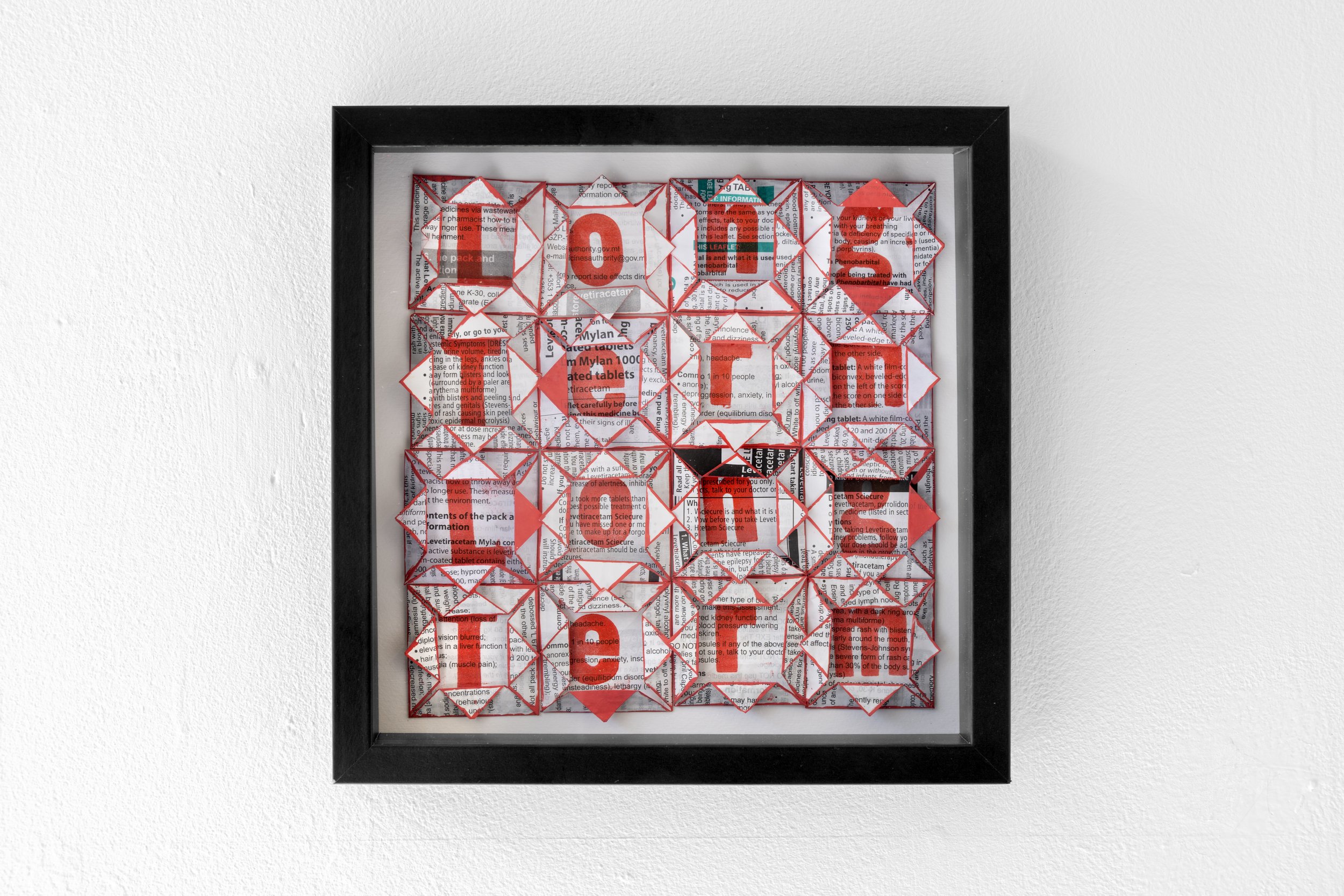 Exhibition photograph of Bini Atkinson's ‘Long Term, Long Term’ on a white wall in White Column is a mixed media artwork and it is normally in the permanent collection of the Mental Health Museum, Wakefield. The work is a twenty-seven-centimetre squa