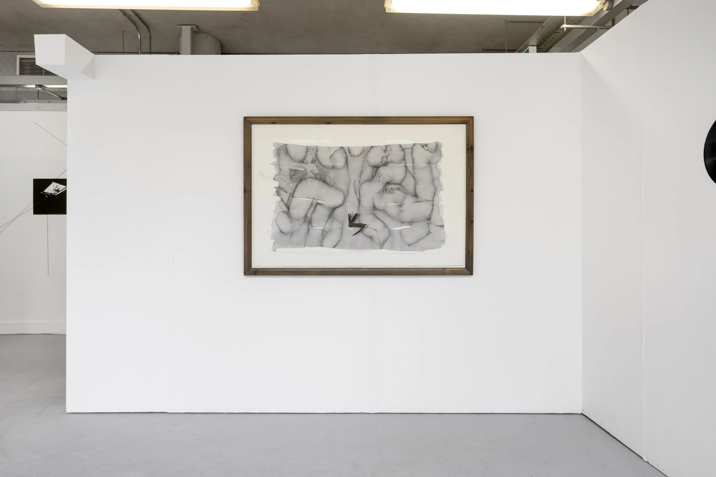 Rose Garrard's '‘Talisman: The Steel Knife of Her Grandmother’ photographed against a white wall in the White Column space. A grouping of nude figures drawn into the grey wash on the ground, filling the picture plane, intersecting each other, and wit