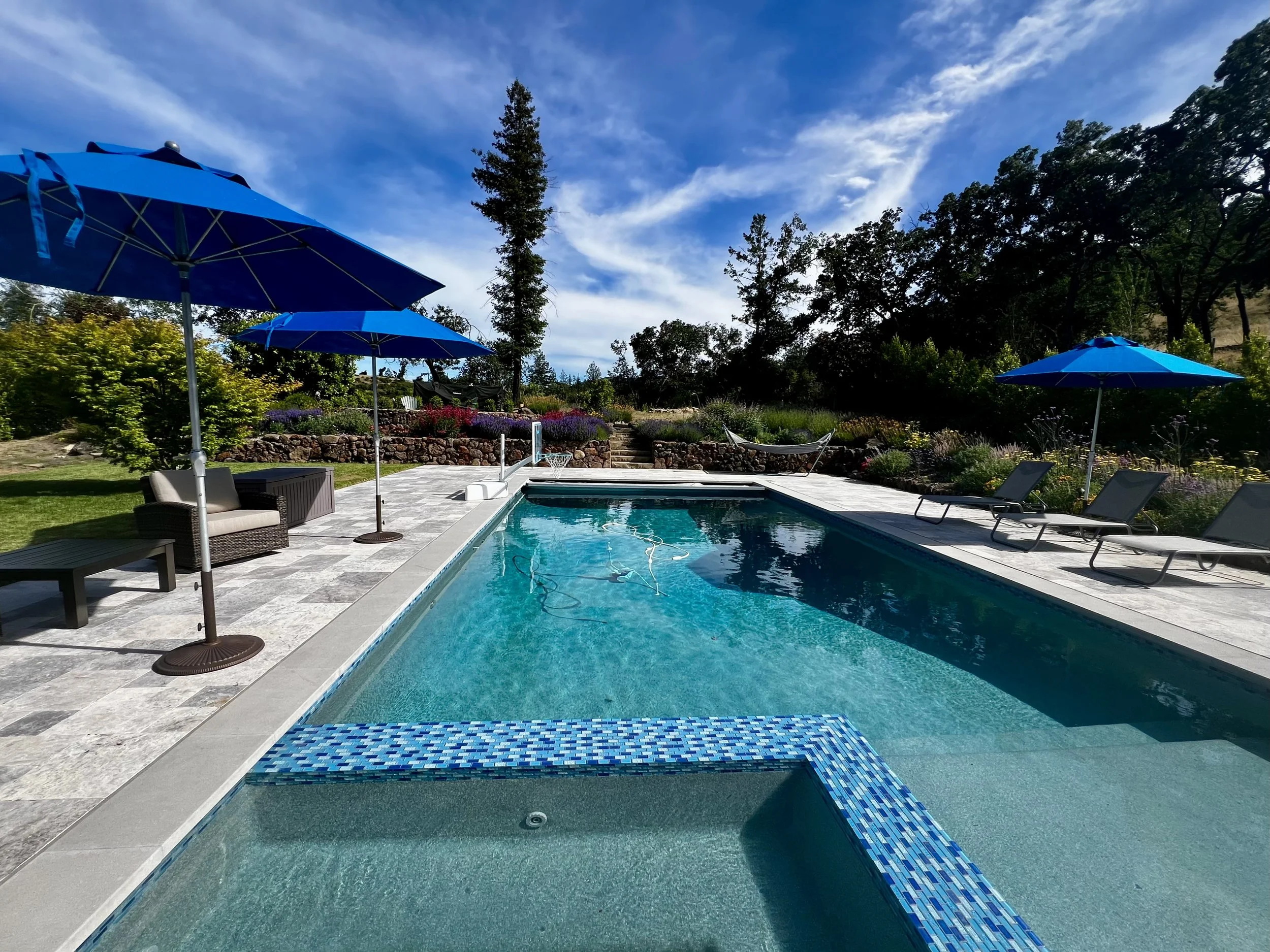 Pool and lounge areas from back deck.jpeg