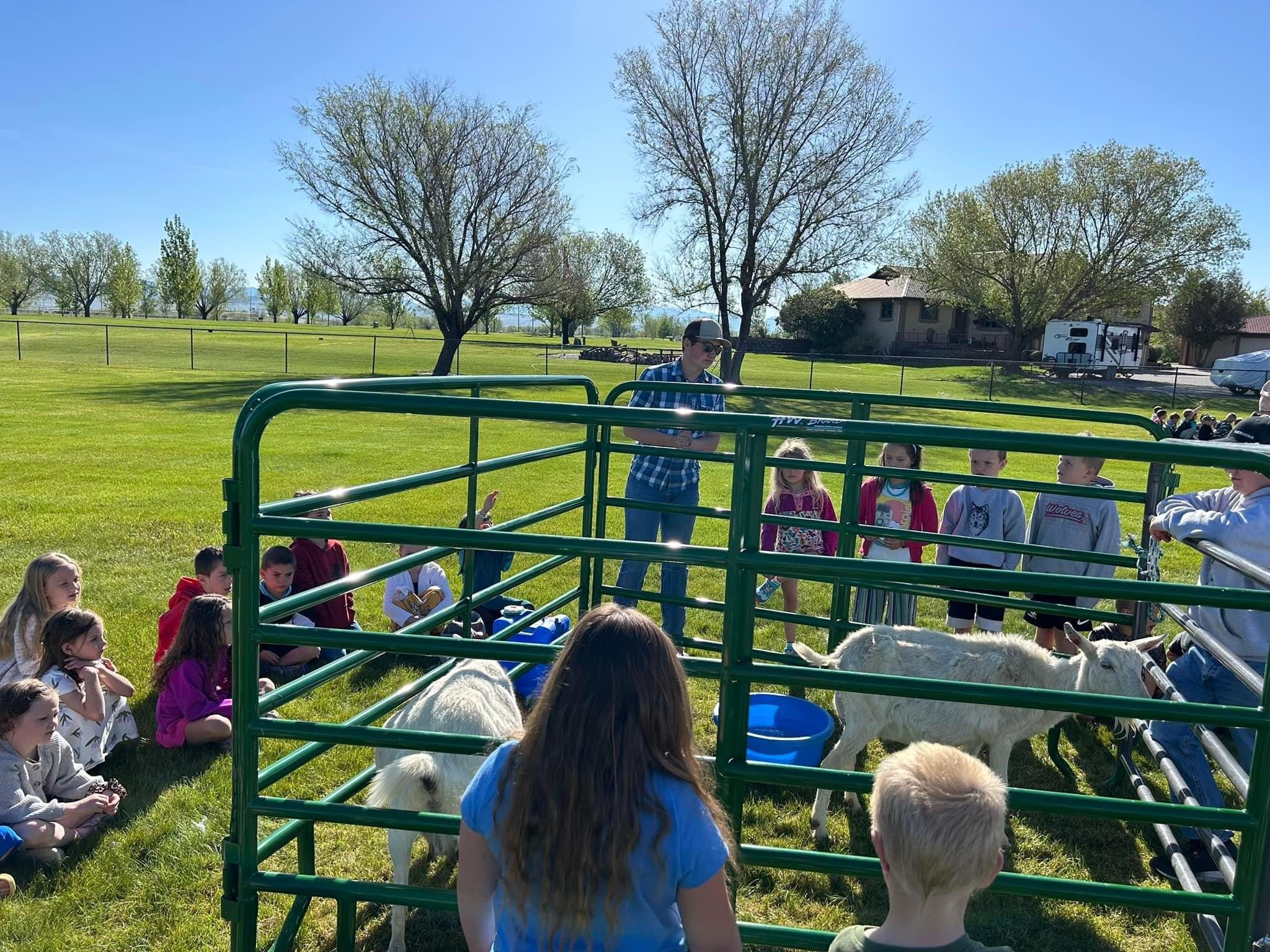 Corban and Fin working at Three Forks FFA Ag Days (for entire elementary school)