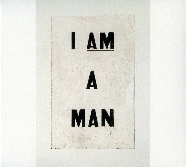 A white poster with the words "I AM A MAN" written in black, bold letters.