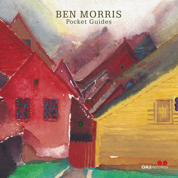 Book cover showing colorful watercolor painting of houses with red roofs and yellow walls, with the title "Ben Morris Pocket Guides" at the top.
