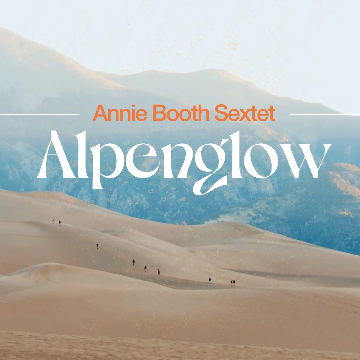 Cover of a book titled 'Alpenglow' by Annie Booth Sextet, showing sand dunes and mountains in the background.