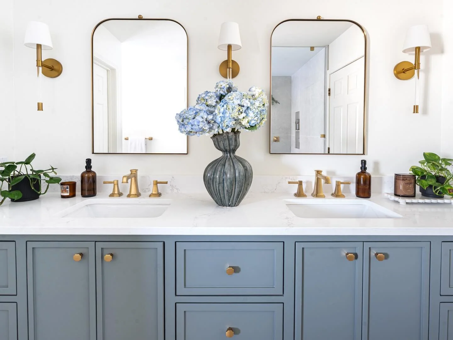 Soft blues, warm brass, and a focus on symmetry bring a once-dated bathroom into a place that feels timeless, calm, and considered.🩵🤍

Every detail was chosen to create balance, warmth, and a sense of quiet luxury.