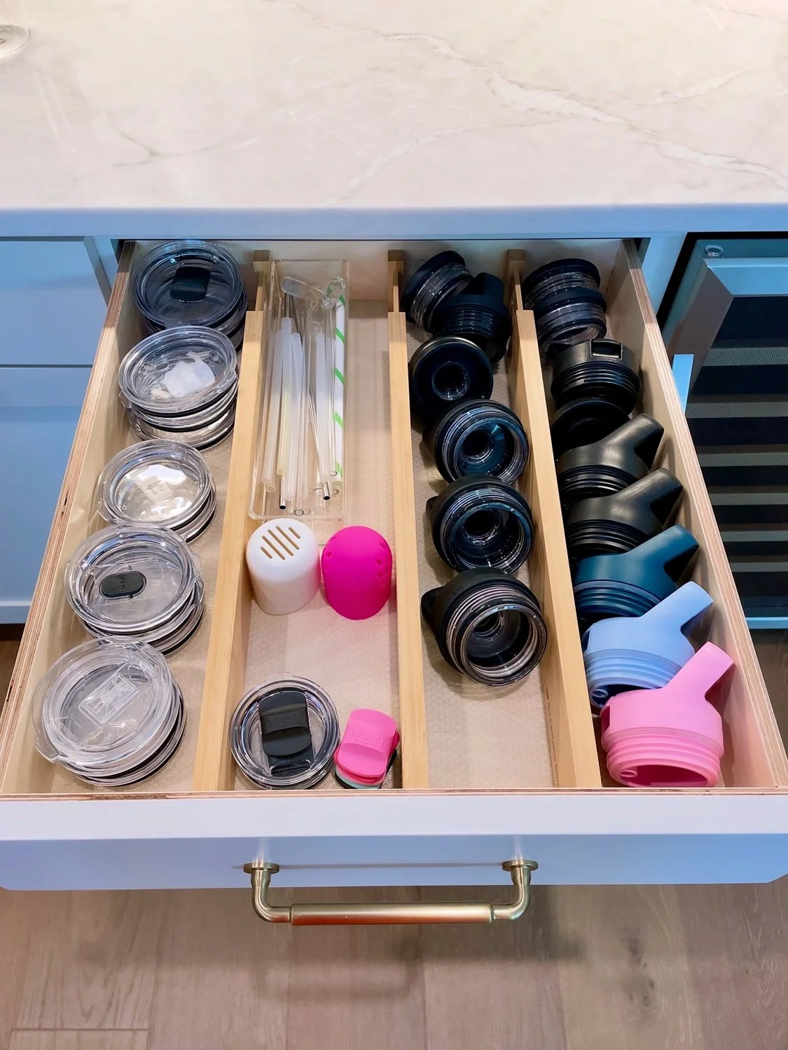 Organized Water Bottle Lids in Drawer.jpg