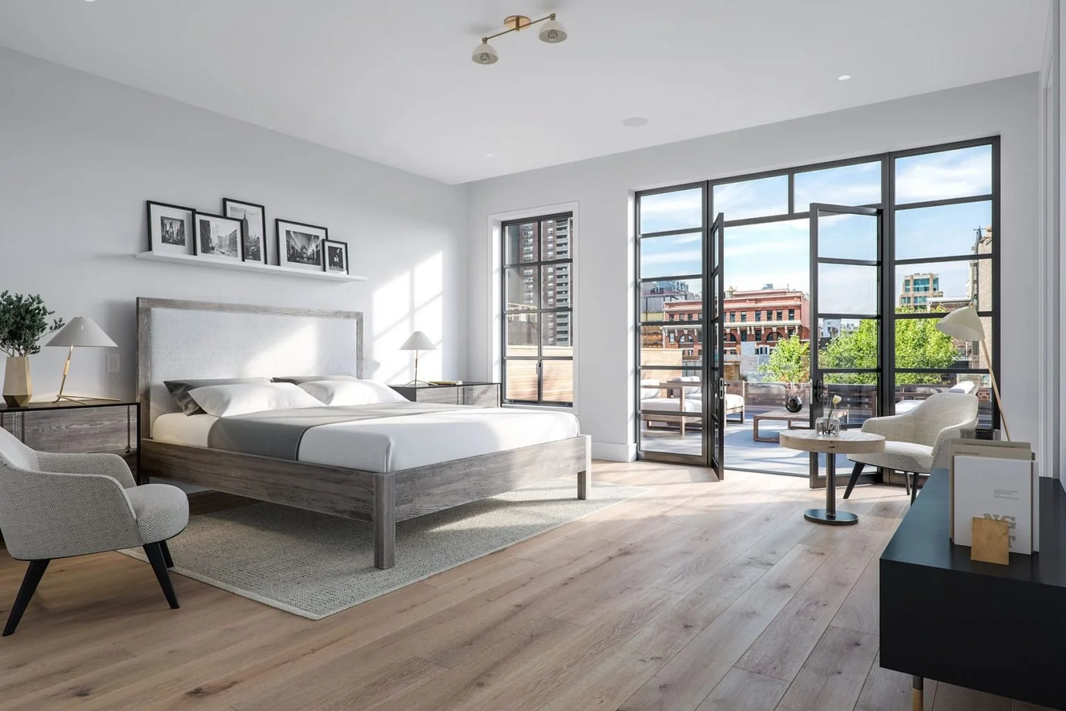 Modern bedroom with large balcony windows, overlooking city buildings and trees, featuring a bed, armchair, side tables, and decor in neutral tones.