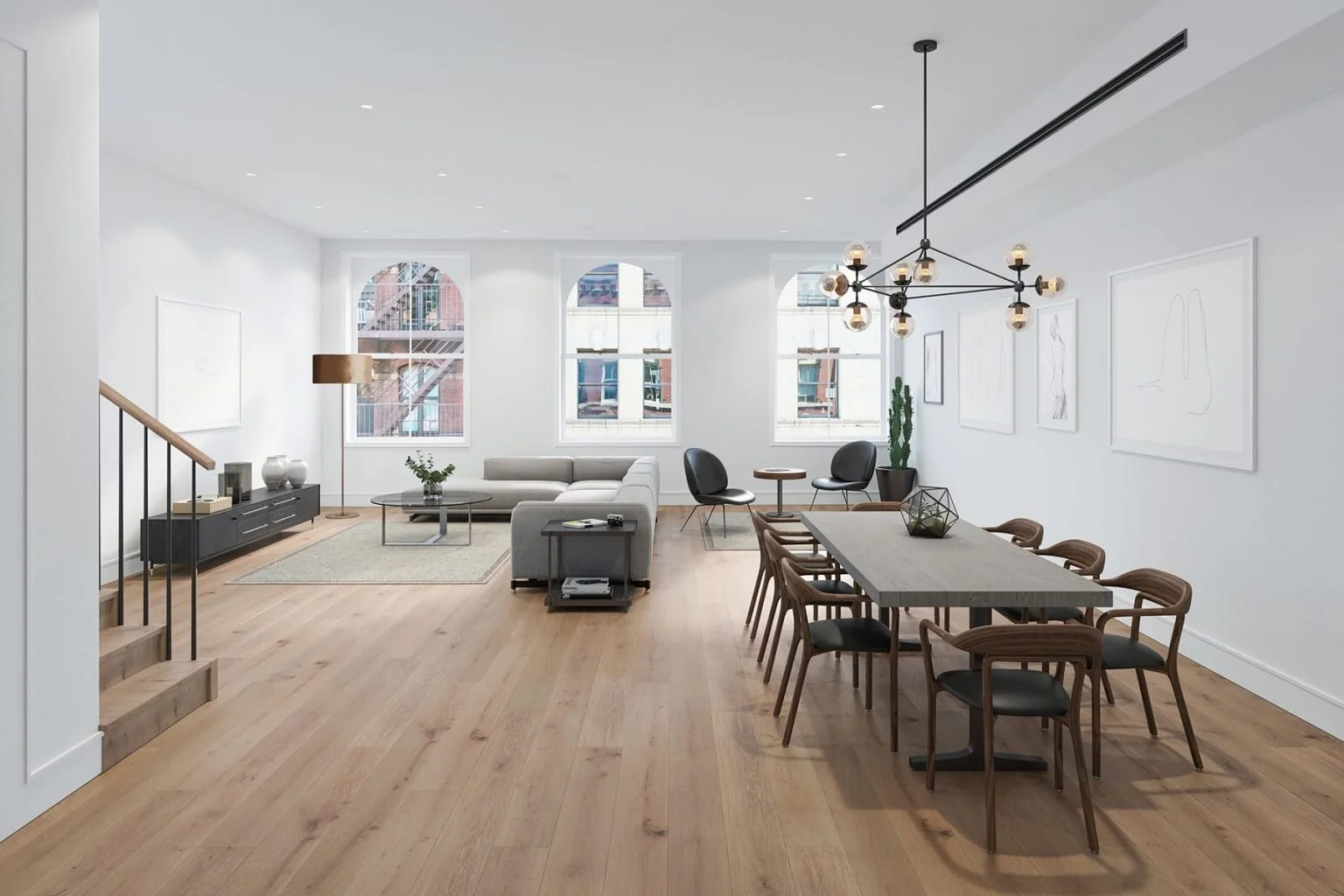 Open-concept living and dining room with wooden flooring, white walls, large windows, modern furniture, and minimal decor.