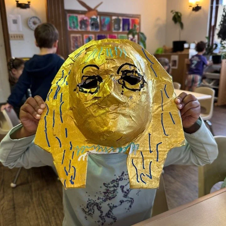 In our Ancient Egypt unit, &ldquo;memory masks&rdquo; help us explore what funerary masks signified. We looked closely at museum photos (gold leaf, lapis-blue stripes, kohl eyeliner, stylized beards), then students constructed their own mask forms fr