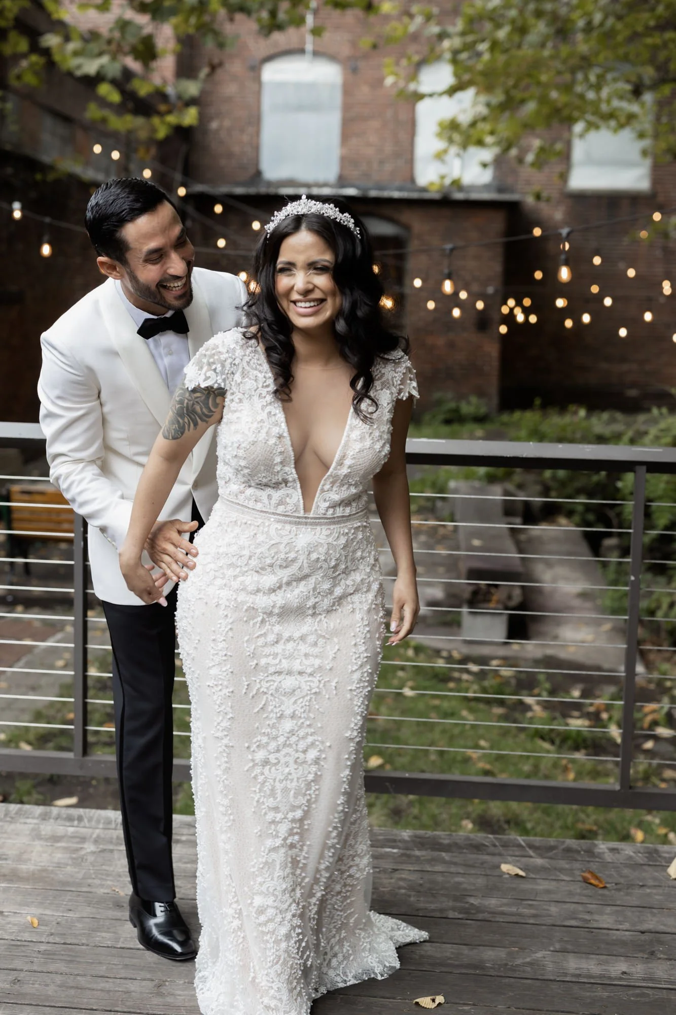 Bride and groom laughing during wedding portraits